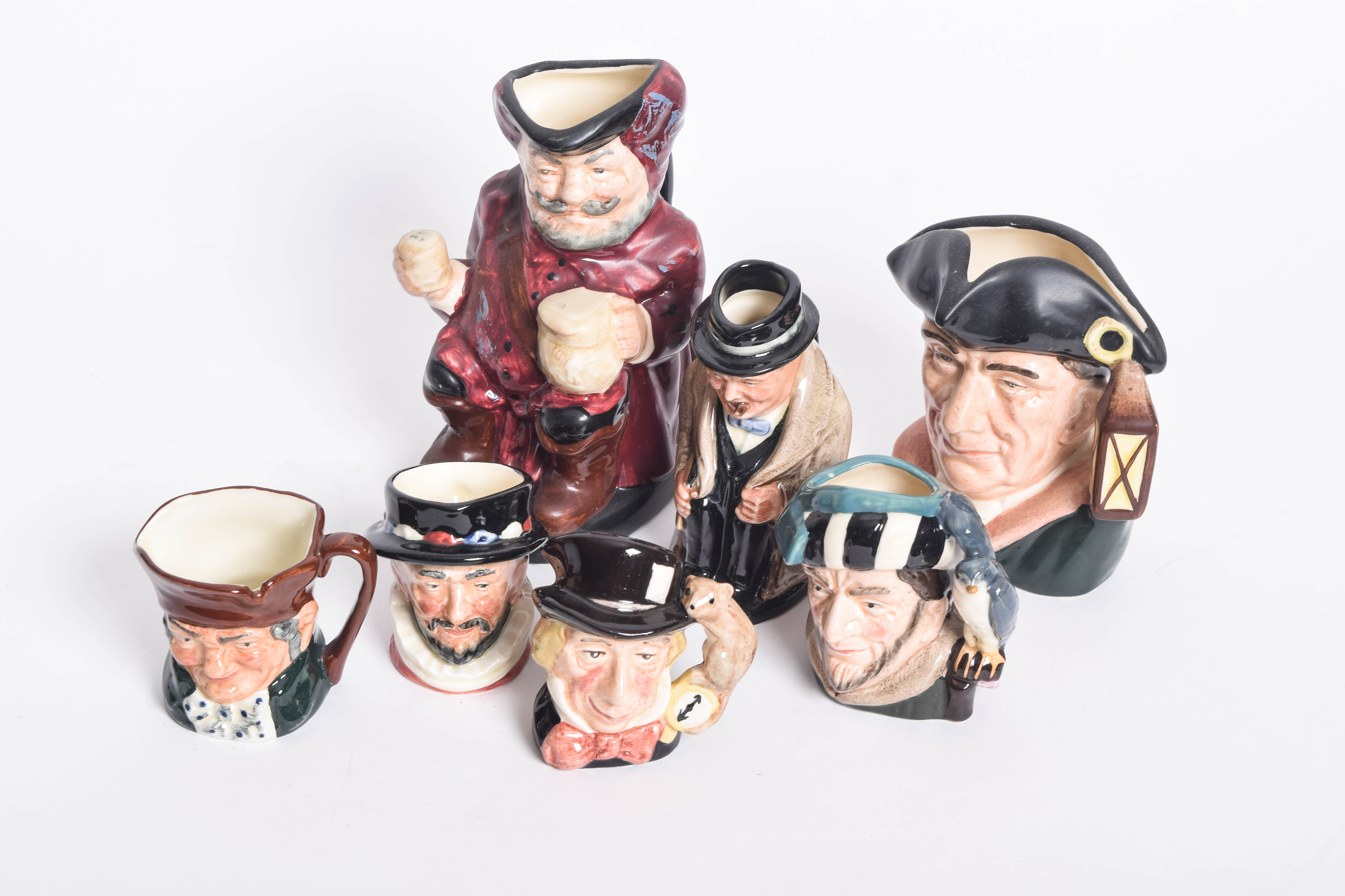 Generous Assortment of  of Royal Doulton Toby Jugs and Character Mugs