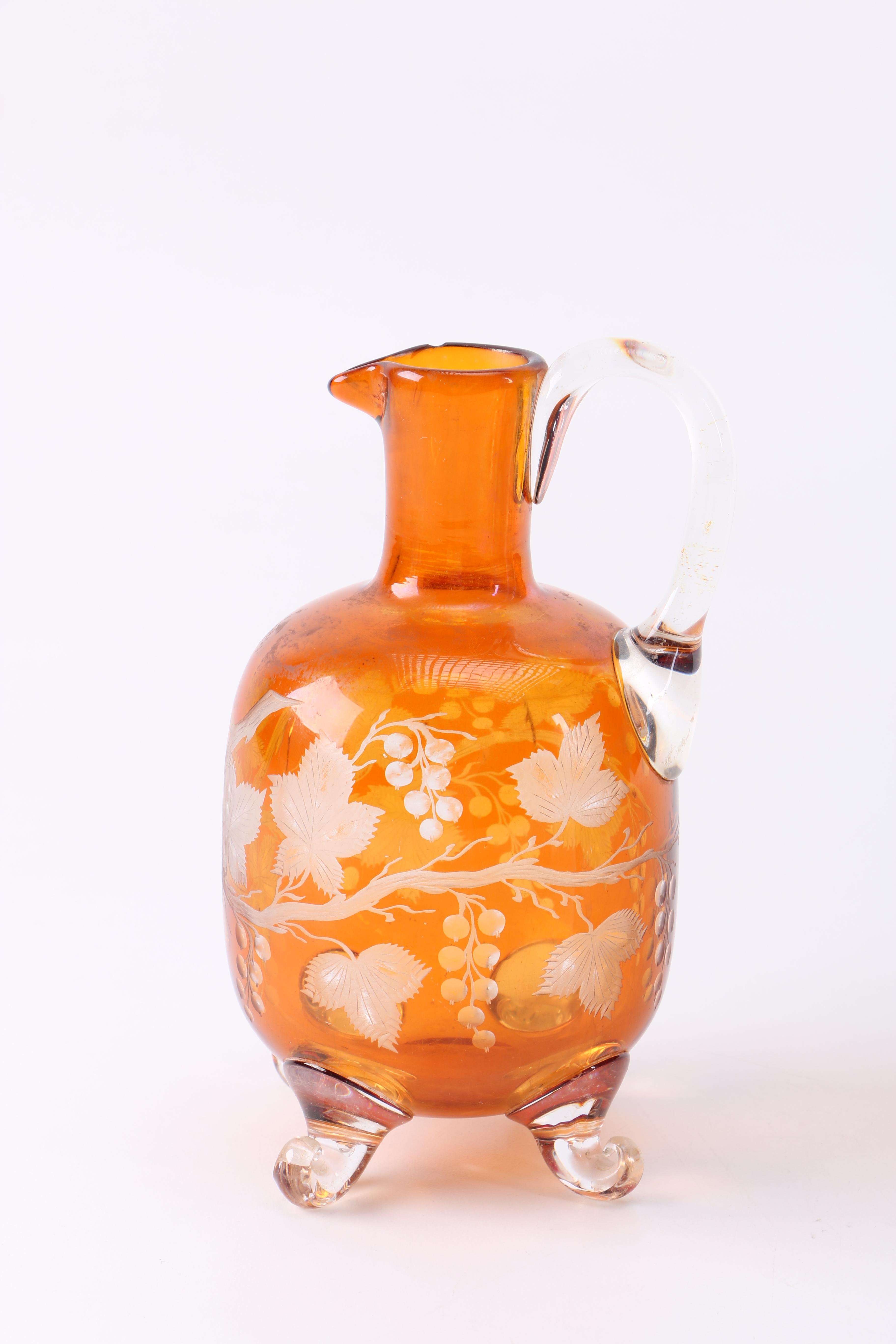 Orange Glass Pitcher and Drinking Glasses