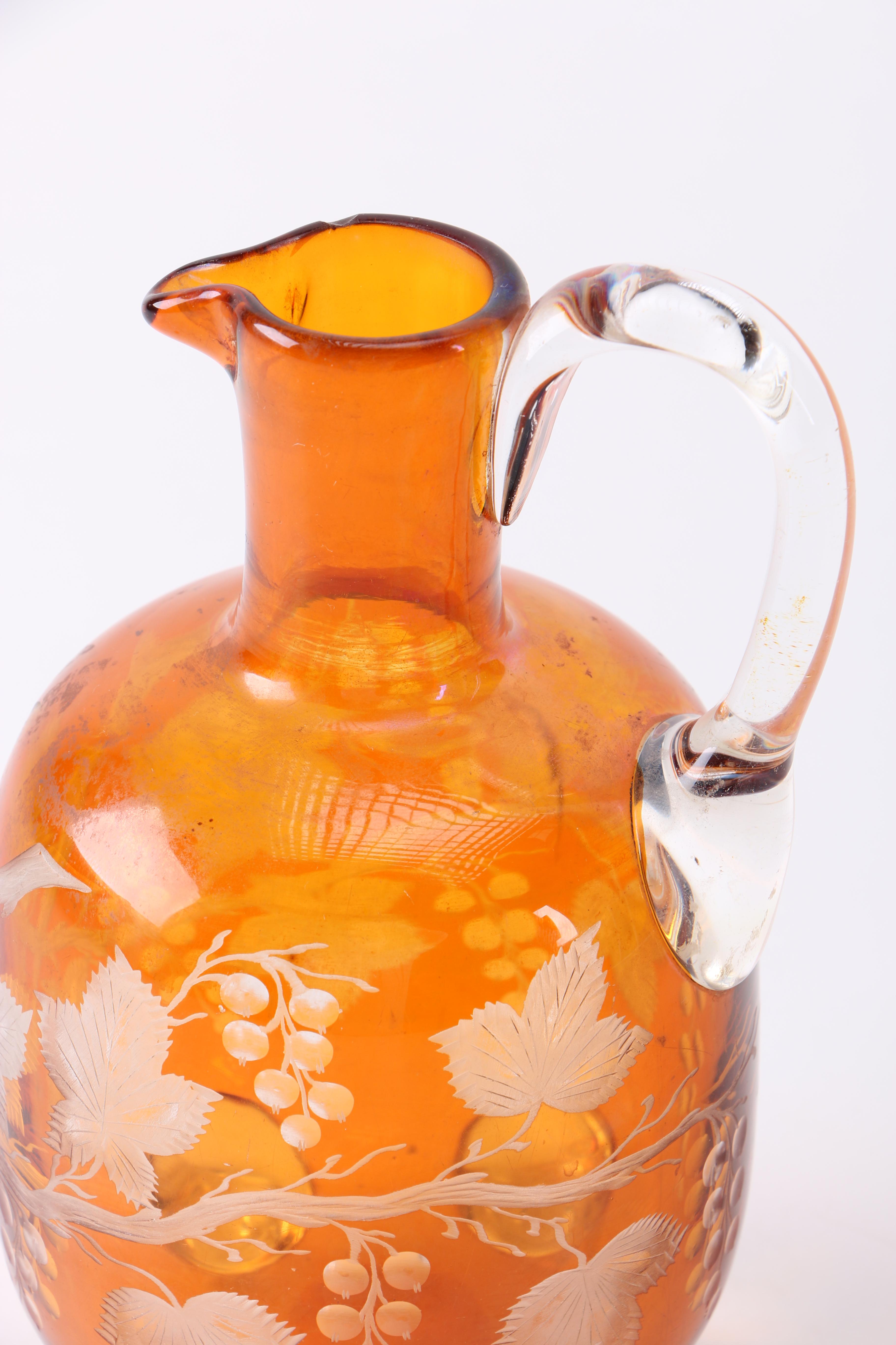 Orange Glass Pitcher and Drinking Glasses
