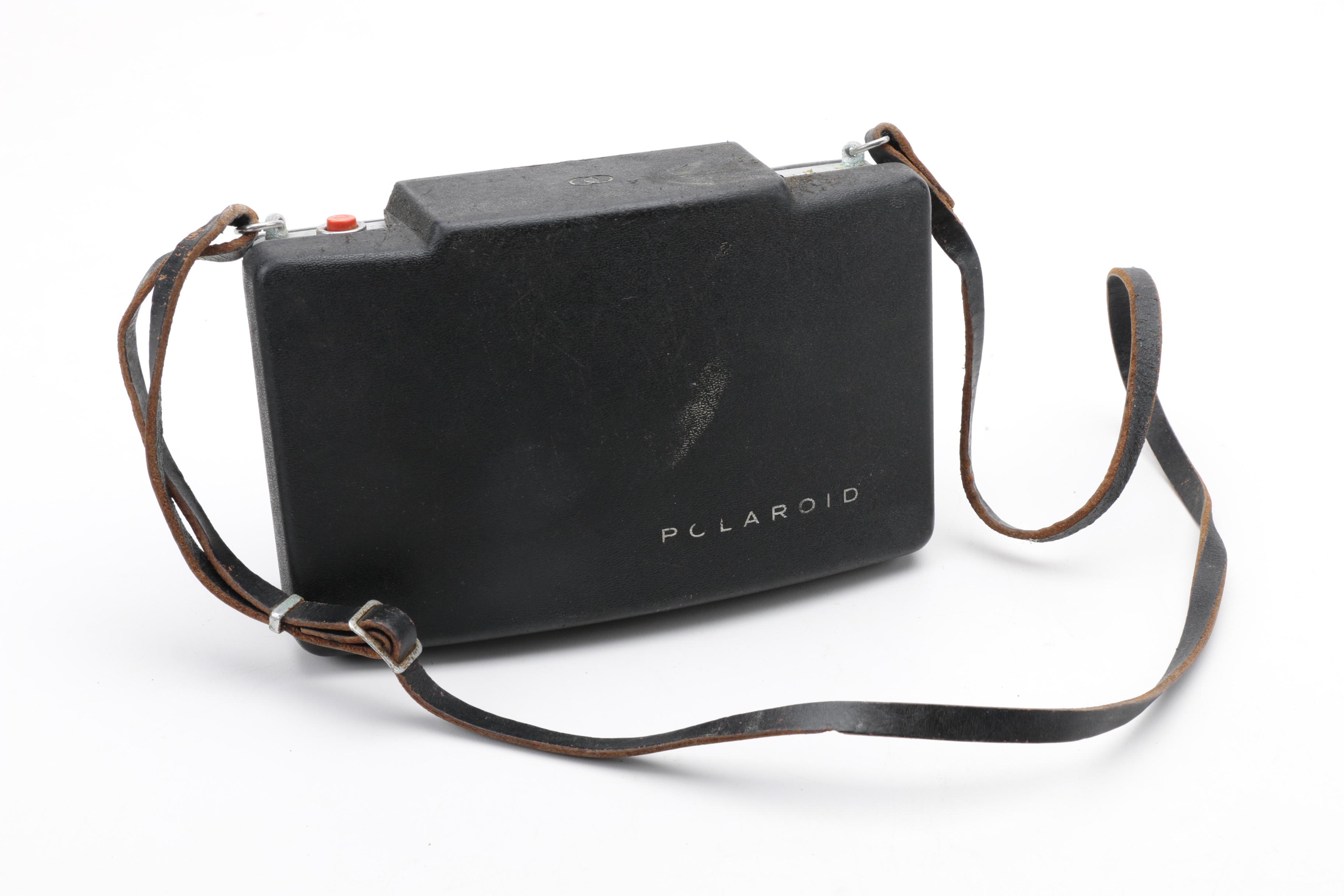 Assortment of Vintage Cameras and Accessories