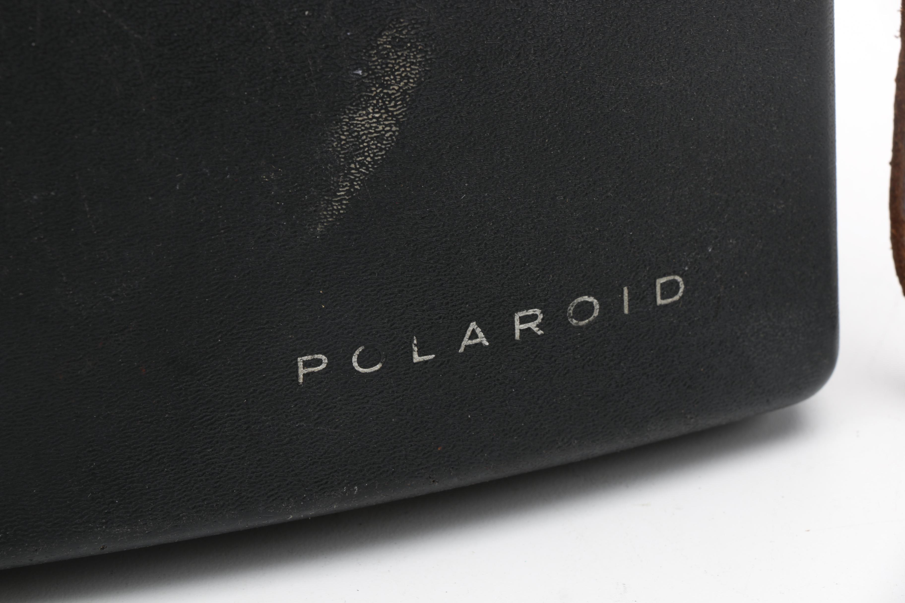 Assortment of Vintage Cameras and Accessories