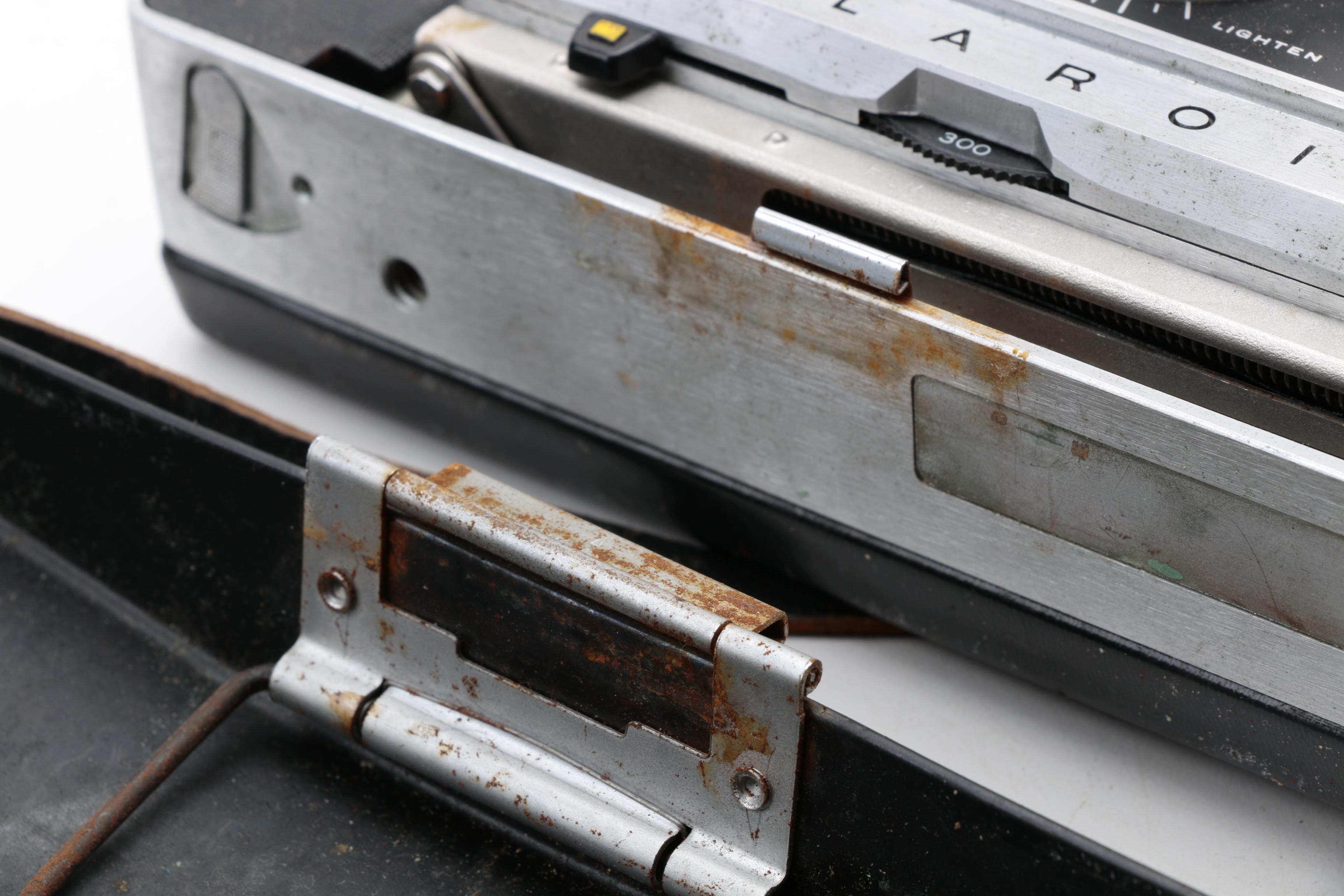 Assortment of Vintage Cameras and Accessories