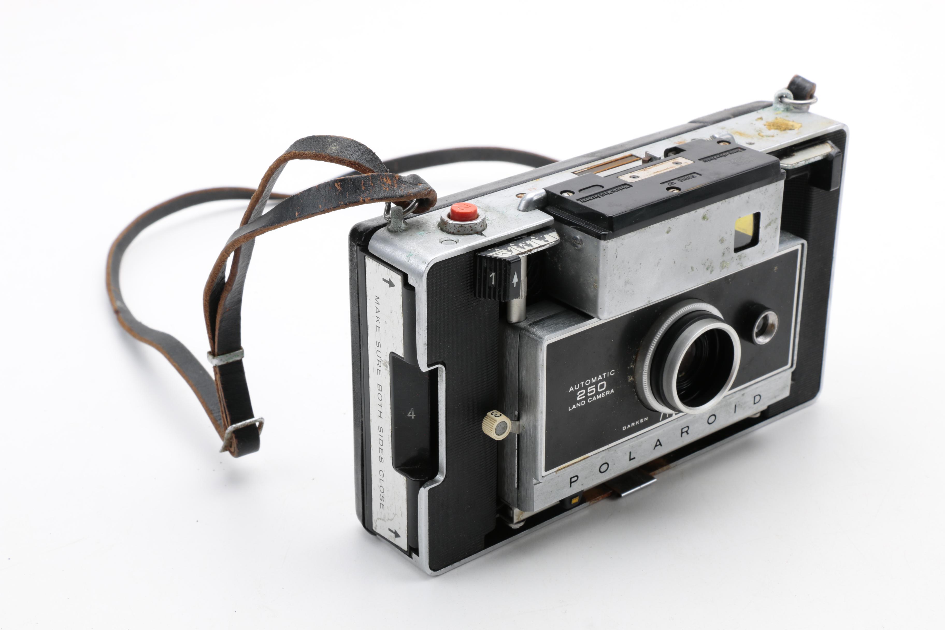 Assortment of Vintage Cameras and Accessories