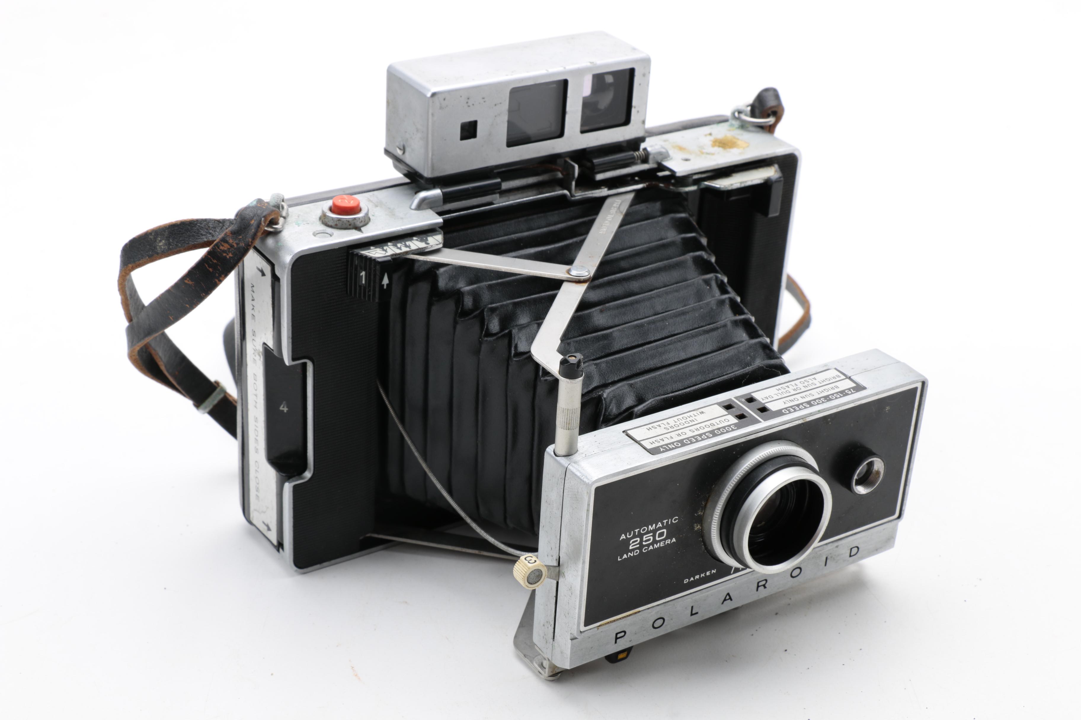 Assortment of Vintage Cameras and Accessories