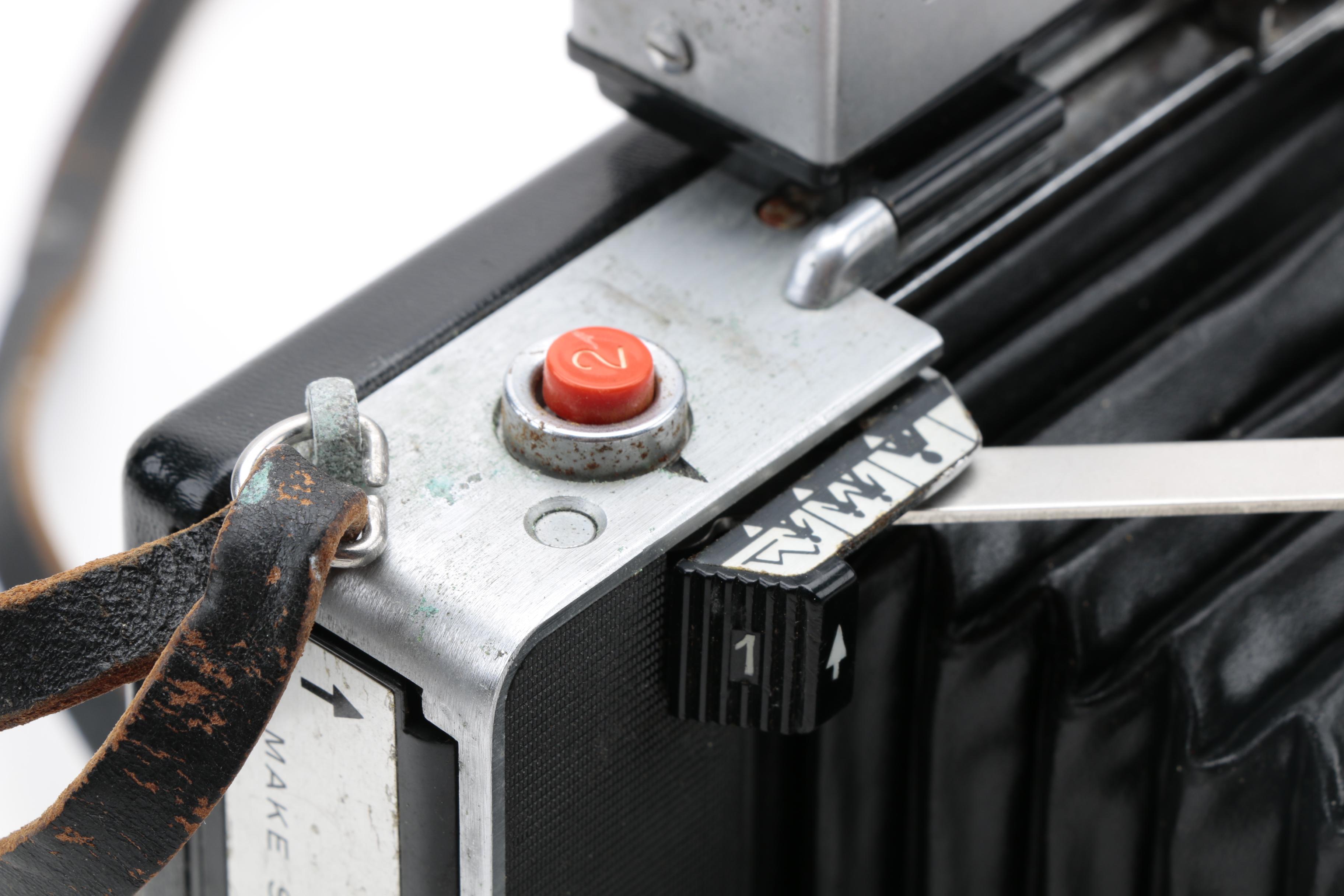 Assortment of Vintage Cameras and Accessories