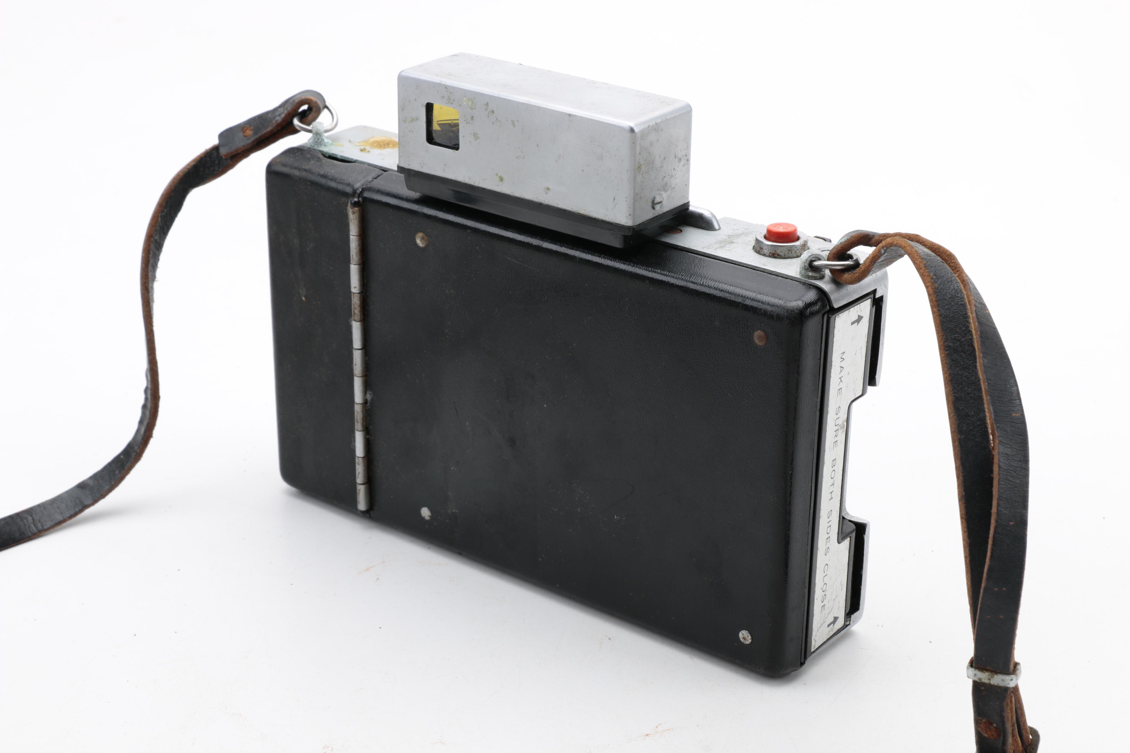 Assortment of Vintage Cameras and Accessories