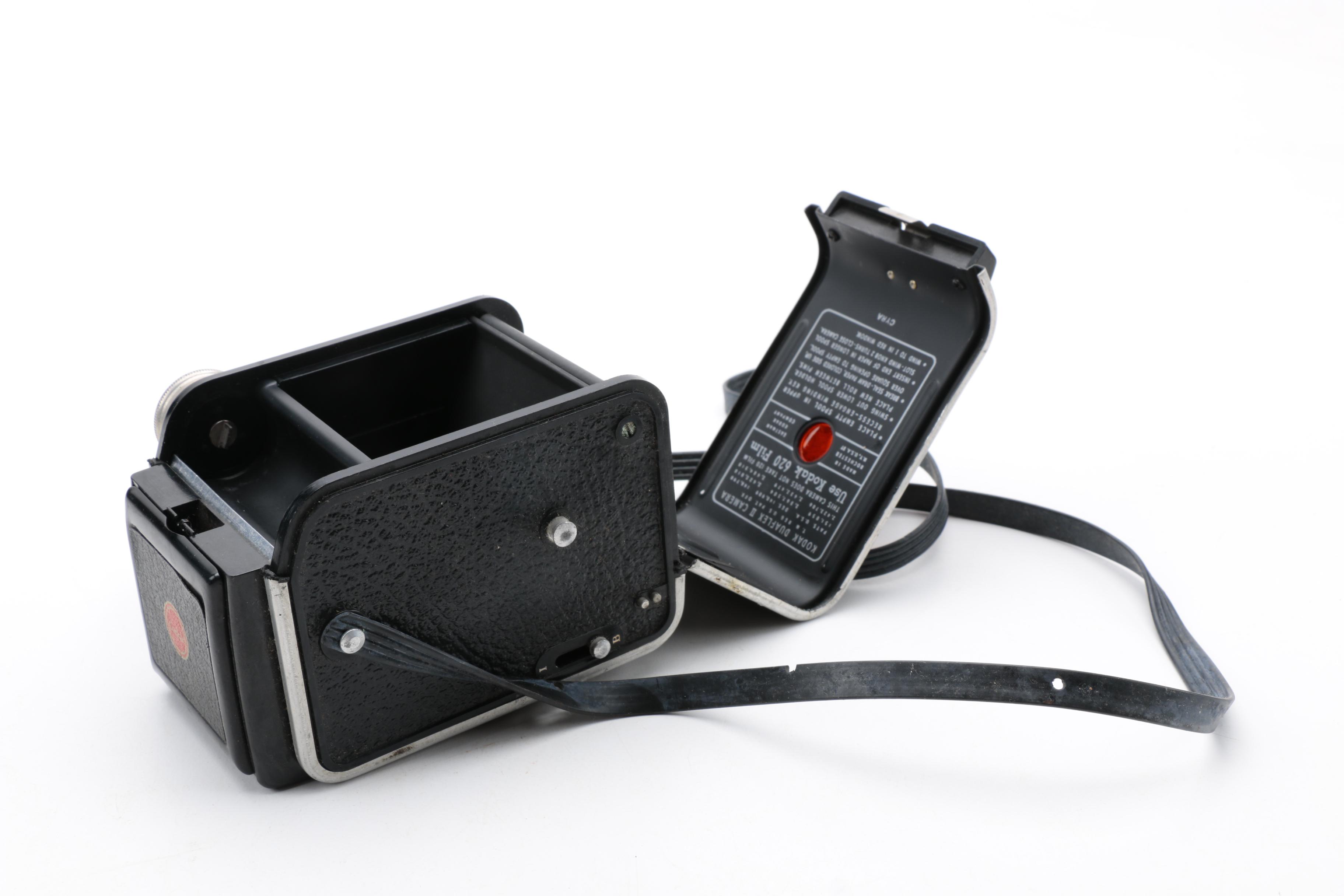 Assortment of Vintage Cameras and Accessories