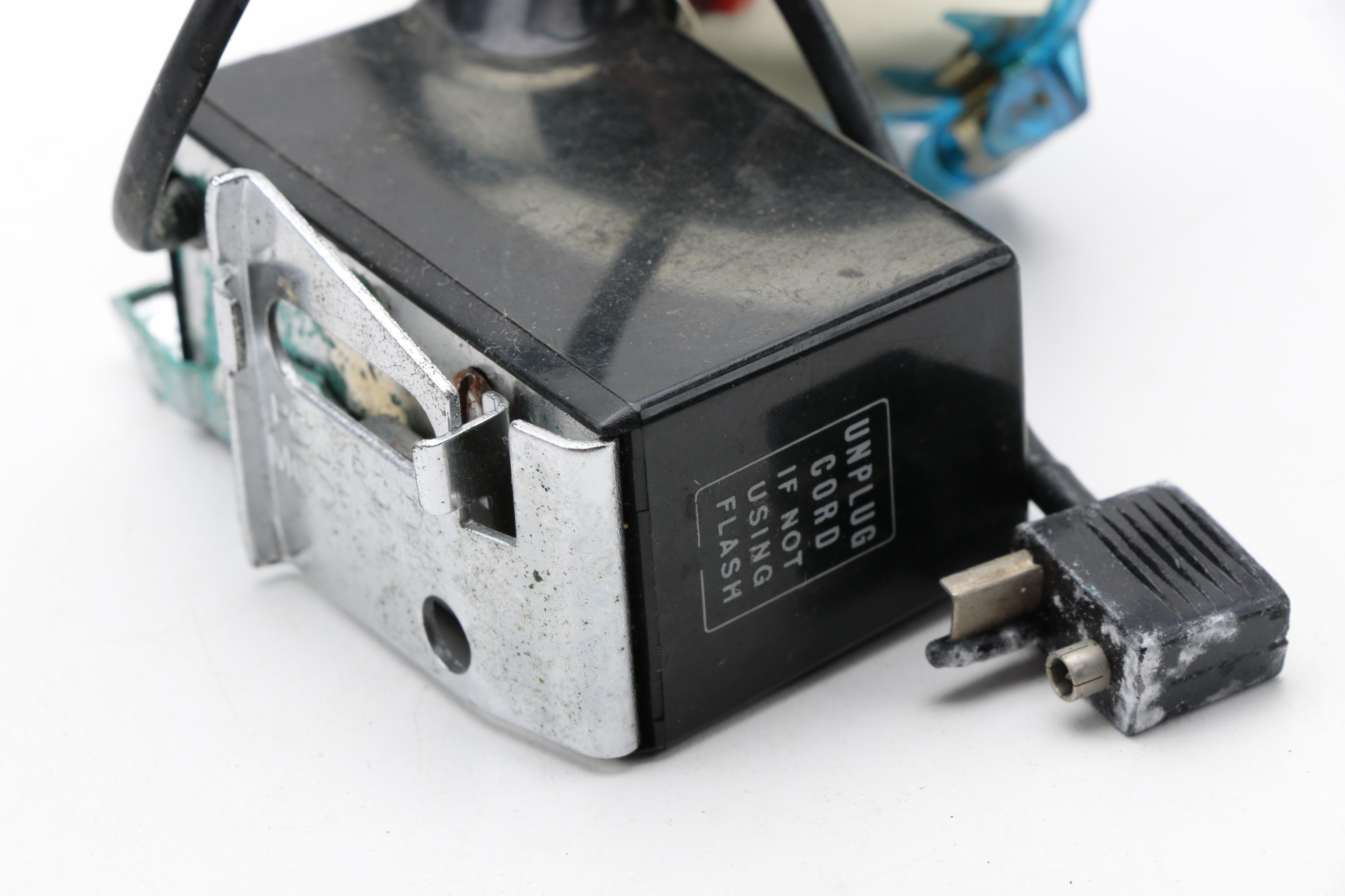 Assortment of Vintage Cameras and Accessories