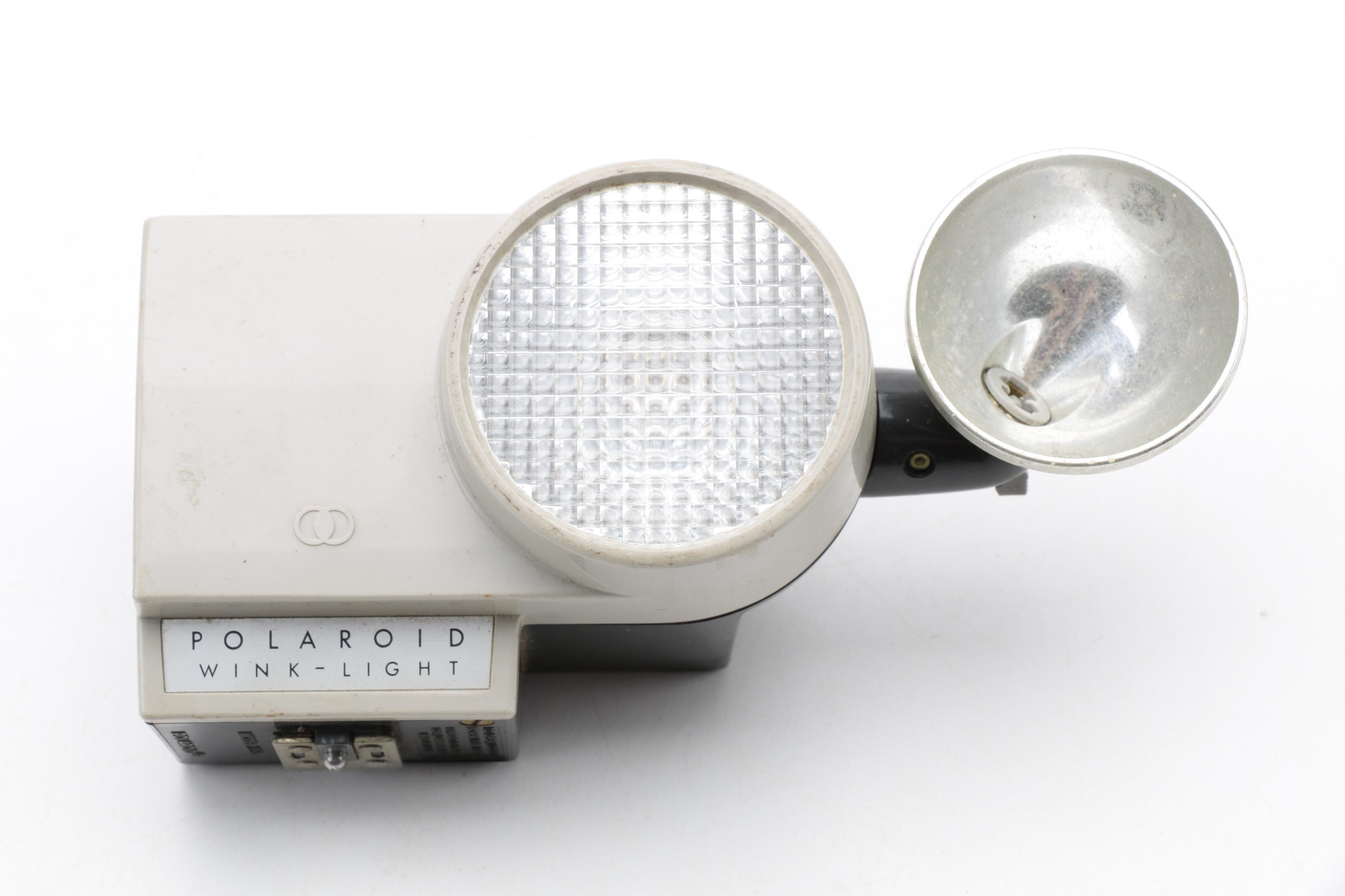 Assortment of Vintage Cameras and Accessories