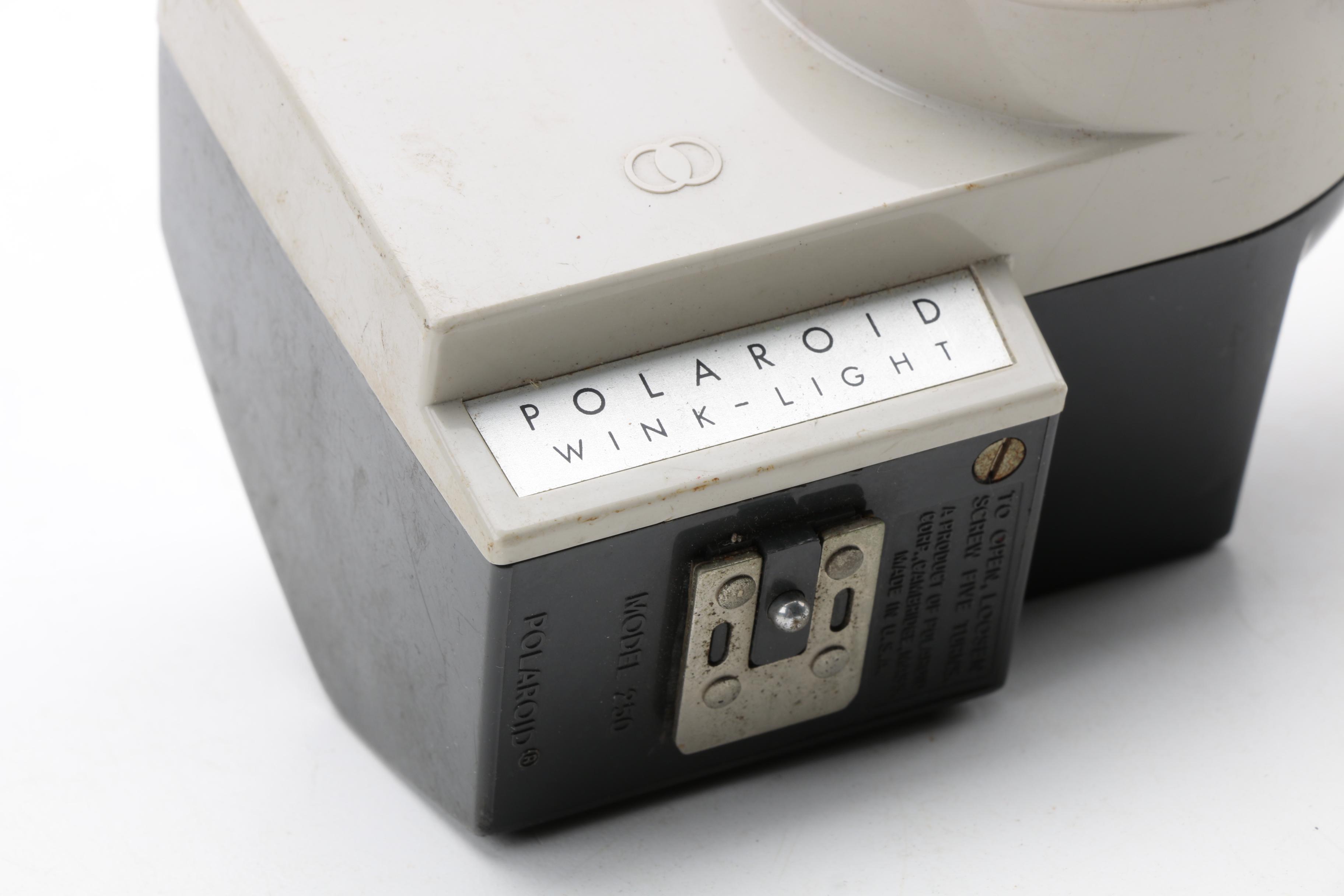 Assortment of Vintage Cameras and Accessories