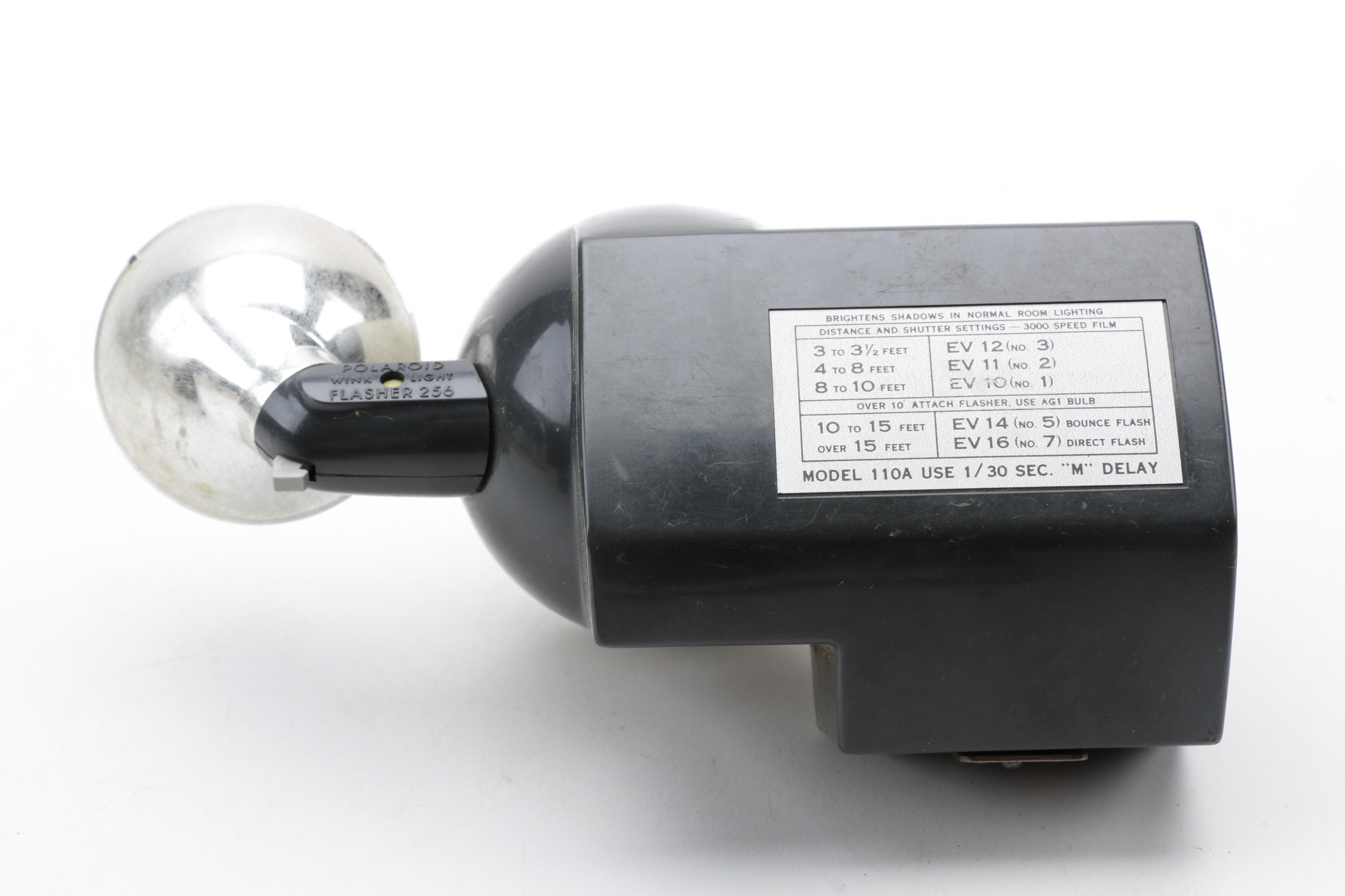 Assortment of Vintage Cameras and Accessories