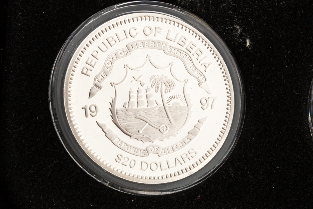 Set of Twenty-Four Commemorative Liberian $20 .999 Silver Coins