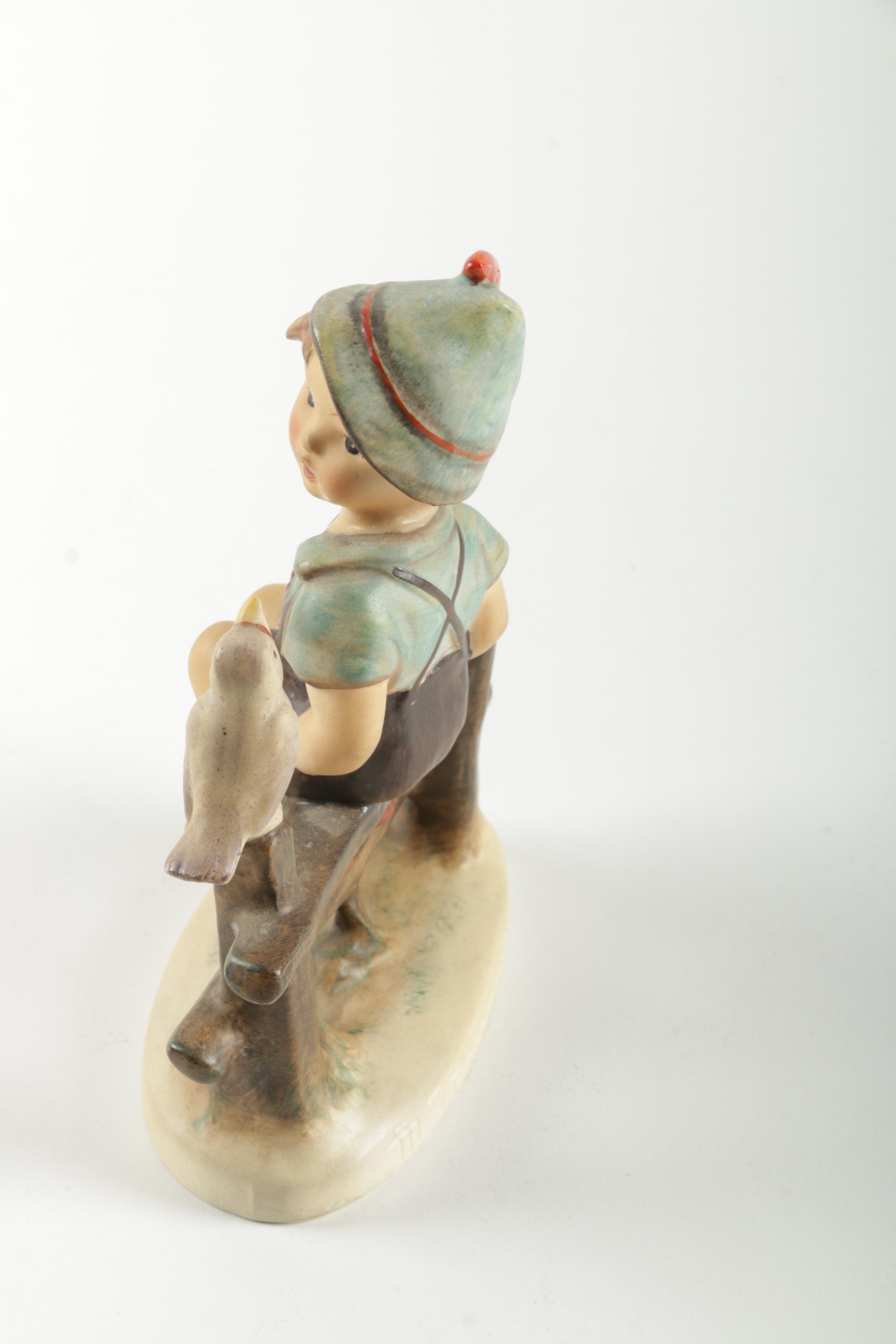 Hummel Boy Sitting On Fence Figurine