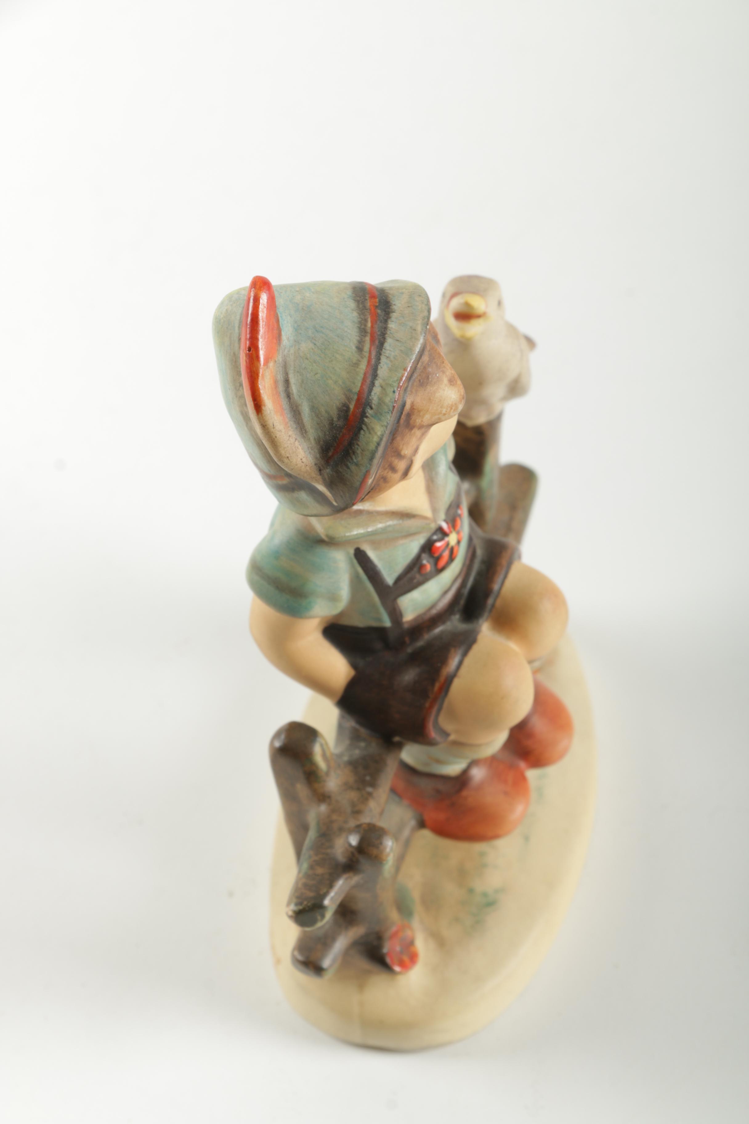 Hummel Boy Sitting On Fence Figurine