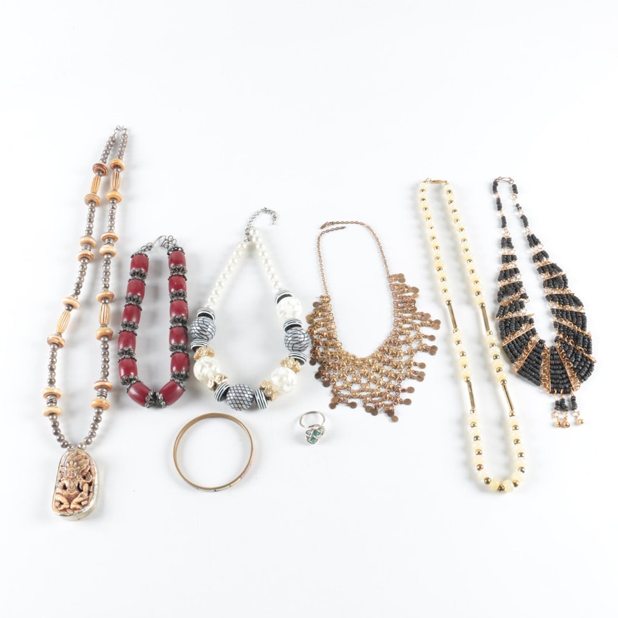 Assorted Jewelry Including a Carved Bone Pendant