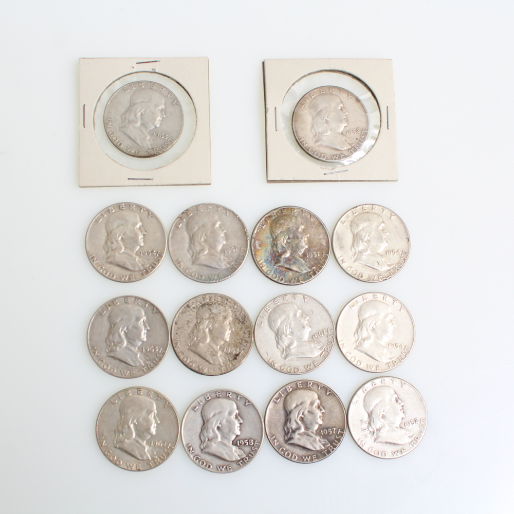 Fourteen Franklin Half Dollars