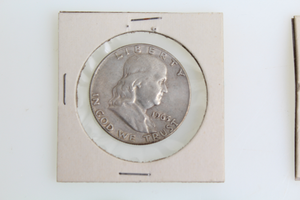 Fourteen Franklin Half Dollars