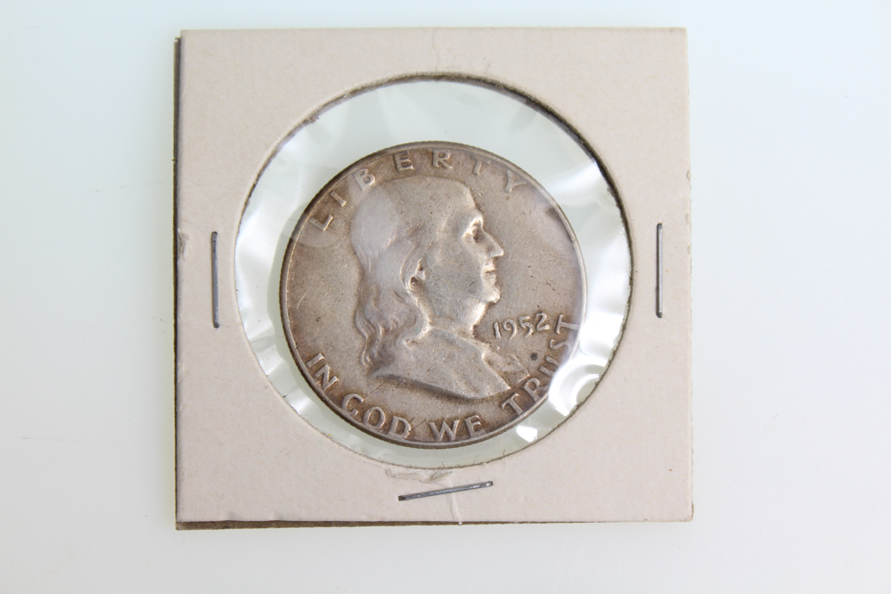 Fourteen Franklin Half Dollars