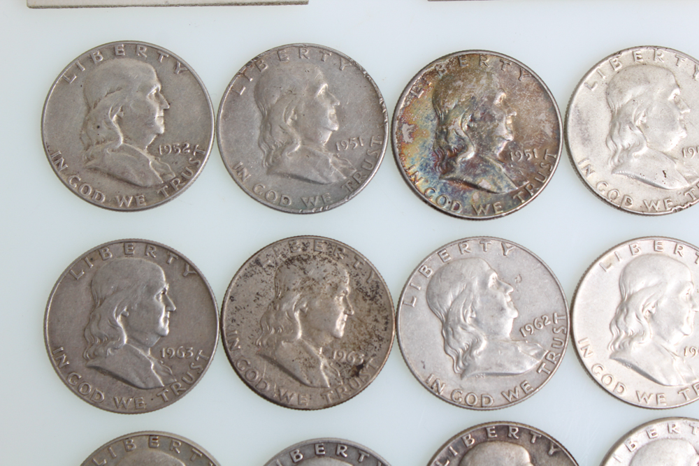 Fourteen Franklin Half Dollars