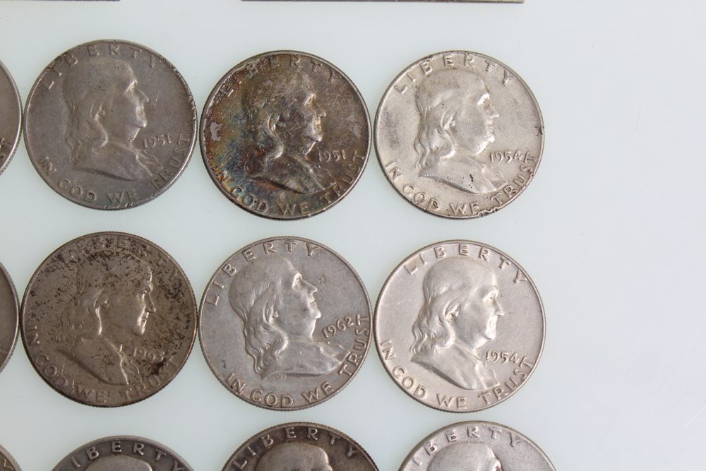 Fourteen Franklin Half Dollars