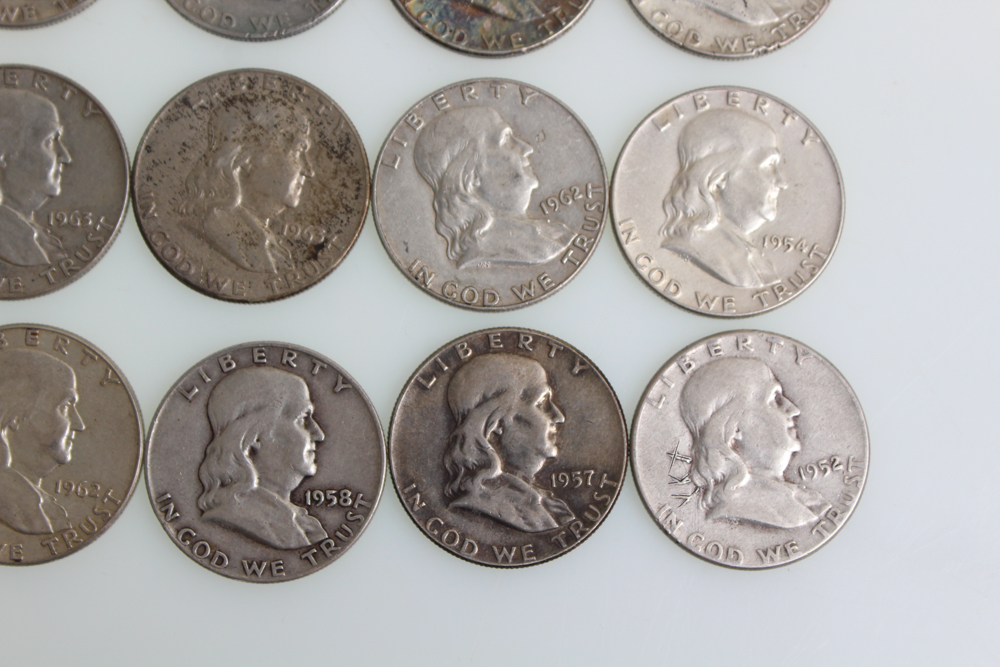 Fourteen Franklin Half Dollars