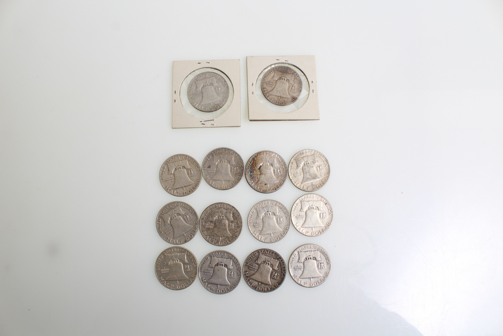 Fourteen Franklin Half Dollars