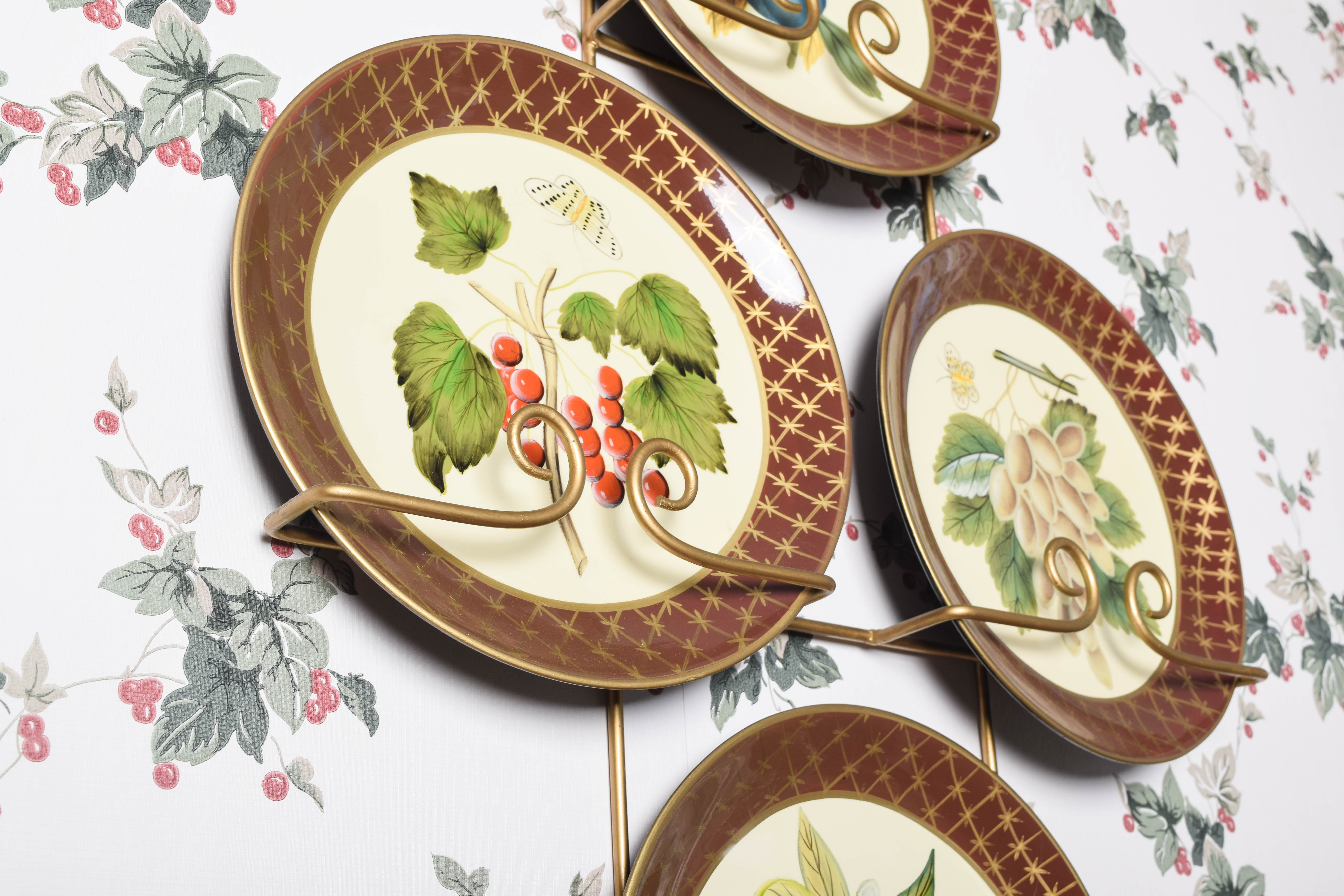 Collection of Raymond Waites Decorative Ceramic Plates and Wall Stands