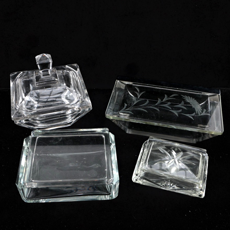 Four Lidded Glass Containers