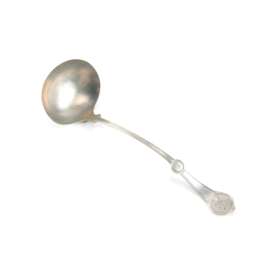 Metal Serving Ladle with a Medallion Handle