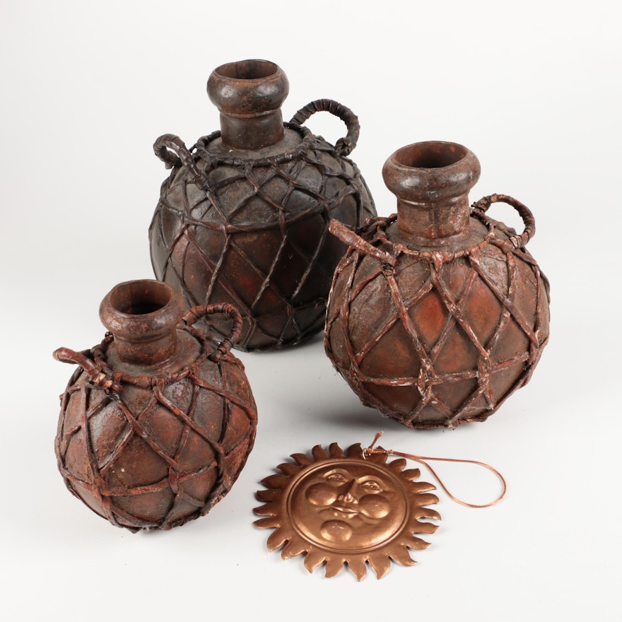 Vintage Reproduction Leather-Caged Wine Casks and Sun Medallion