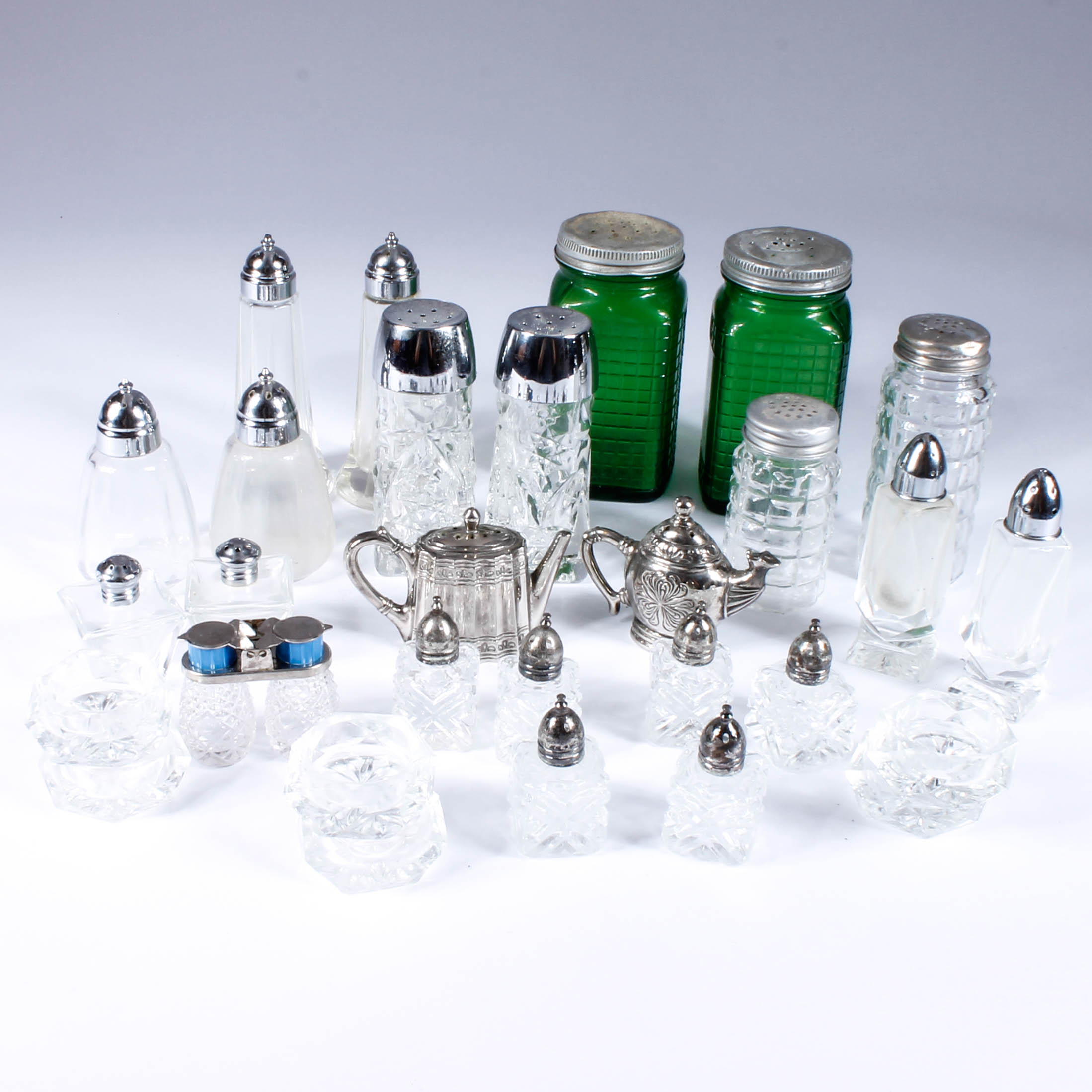 Assortment of Salt and Pepper Shakers with Salt Cellars