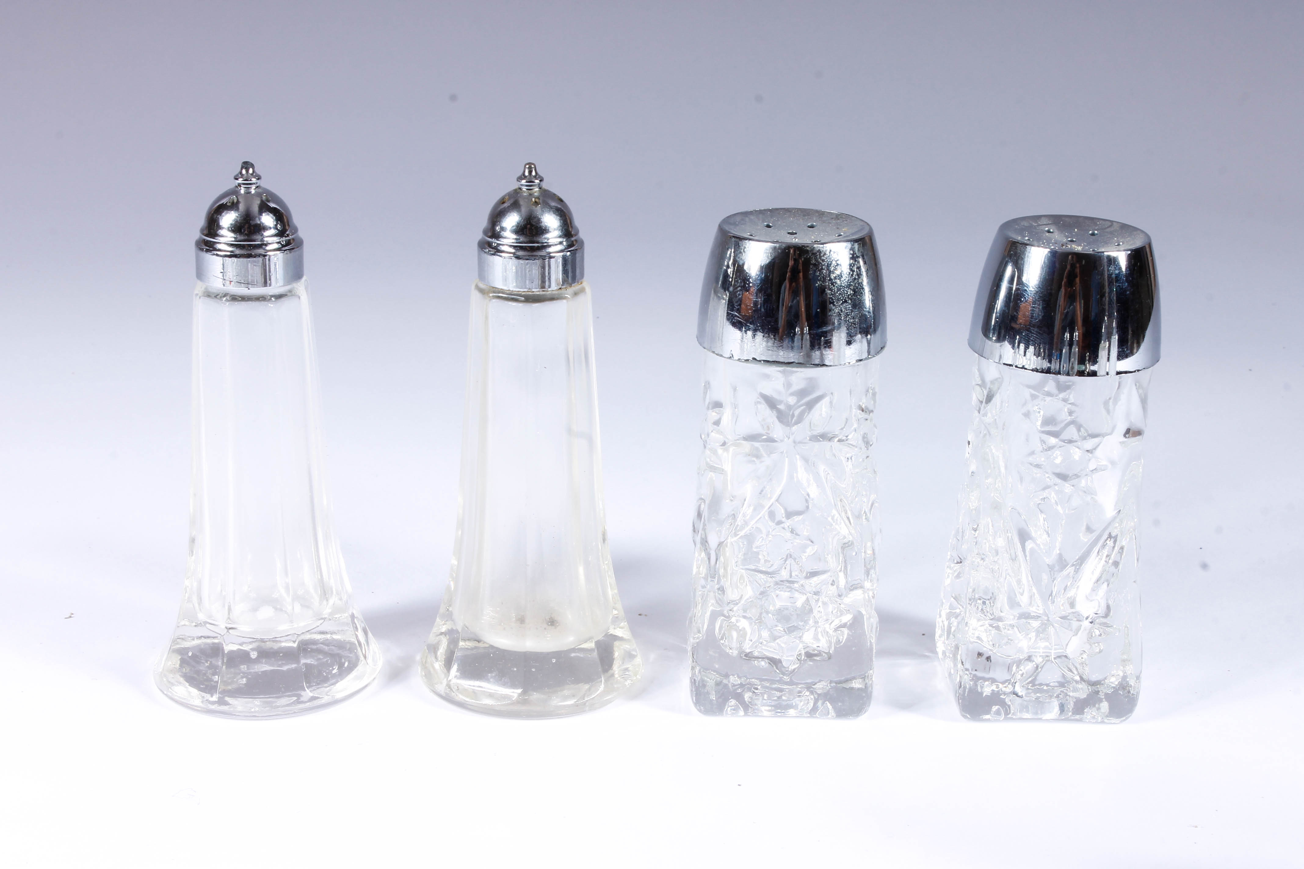 Assortment of Salt and Pepper Shakers with Salt Cellars