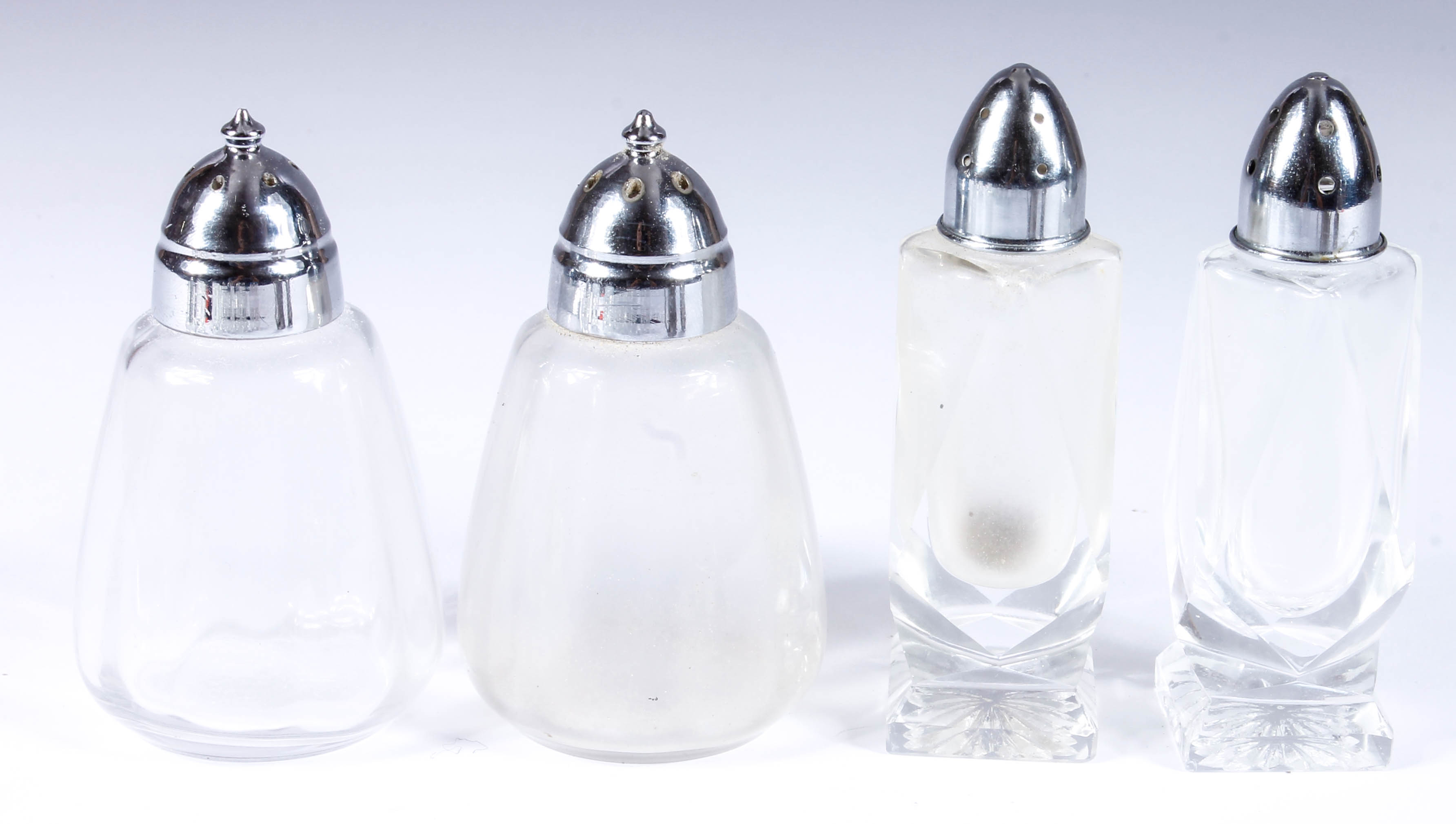 Assortment of Salt and Pepper Shakers with Salt Cellars