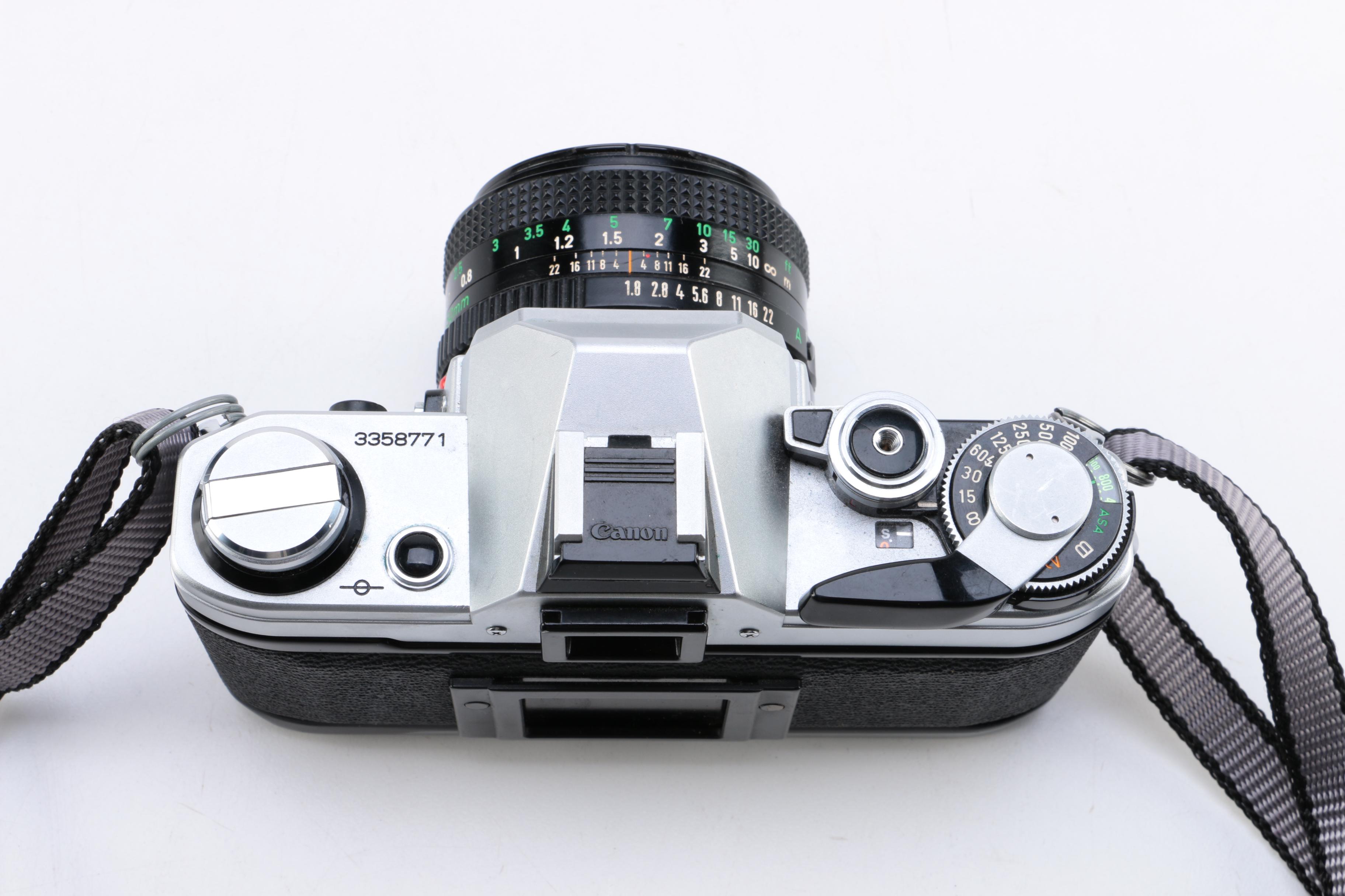 Canon AE-1 Camera with Vintage Eastman Kodak Photography Book