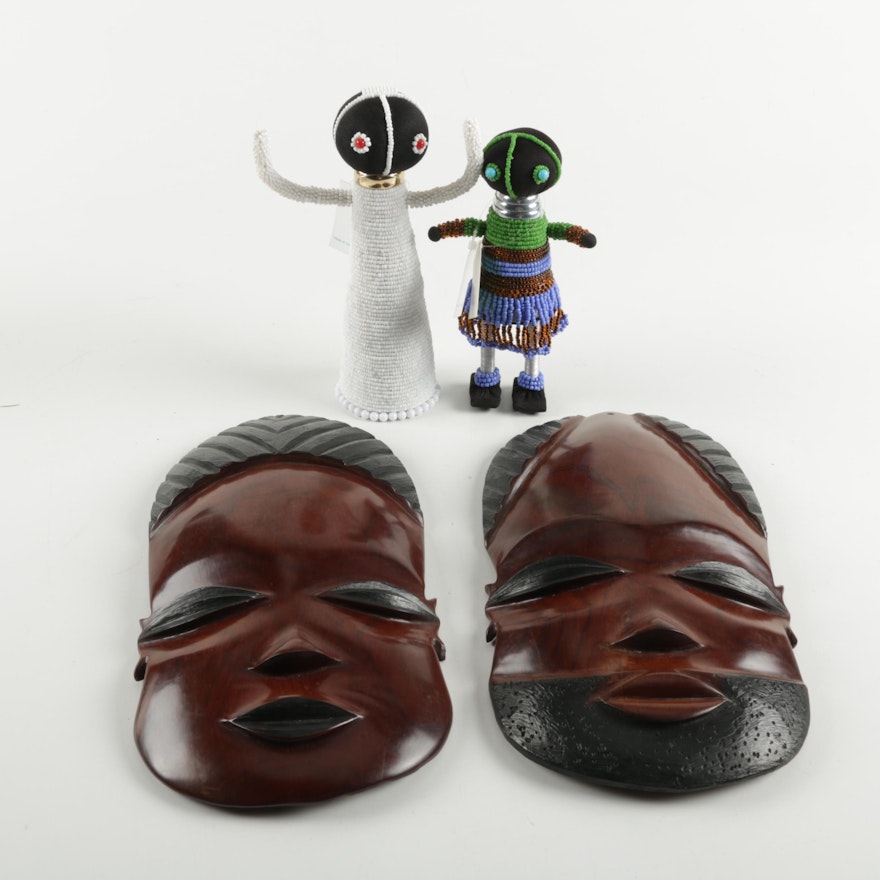 Pair of Central African Masks with Two Bead Dolls