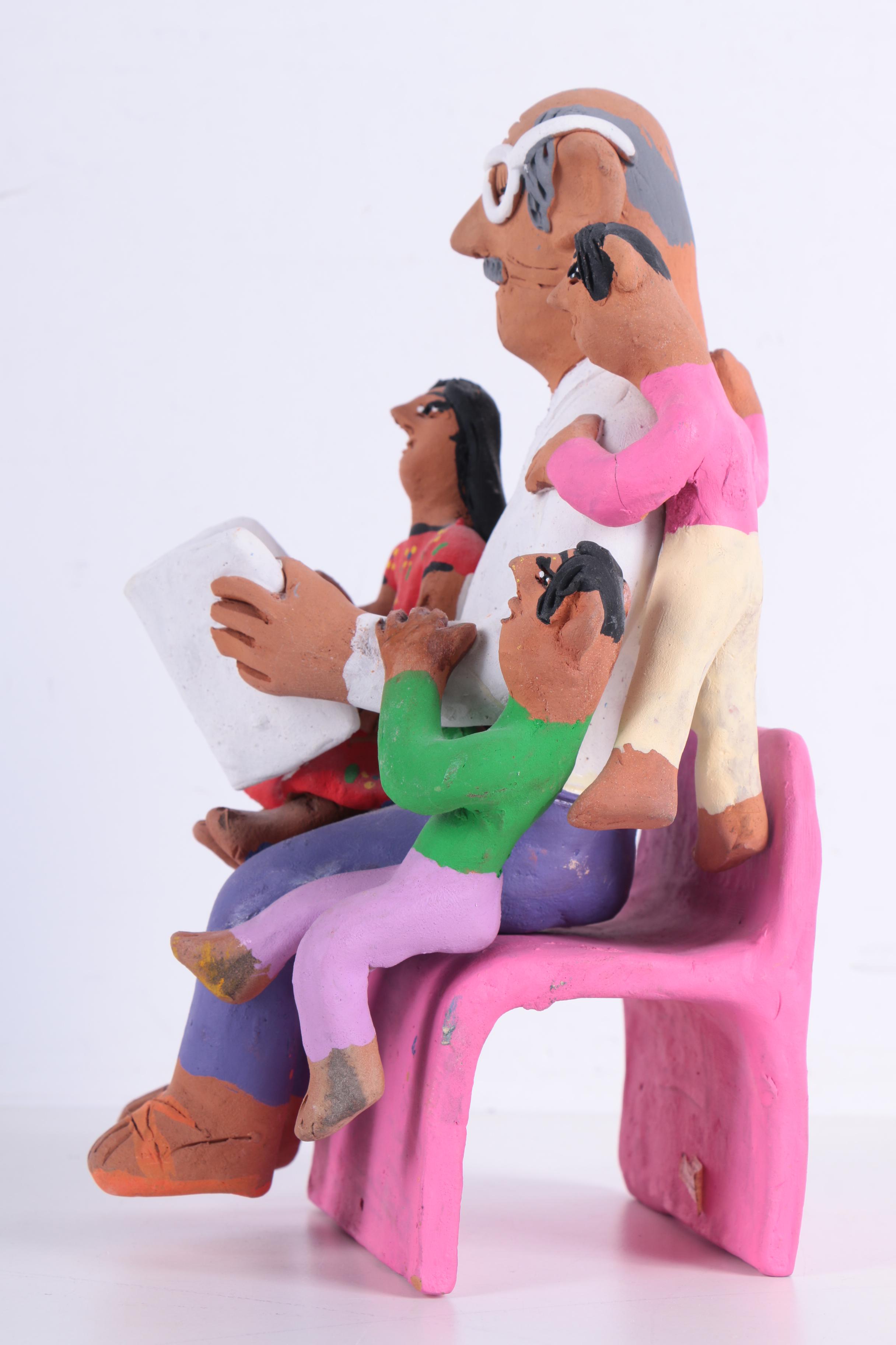 Josefina Aguilar Clay Figure of Man Reading to Children