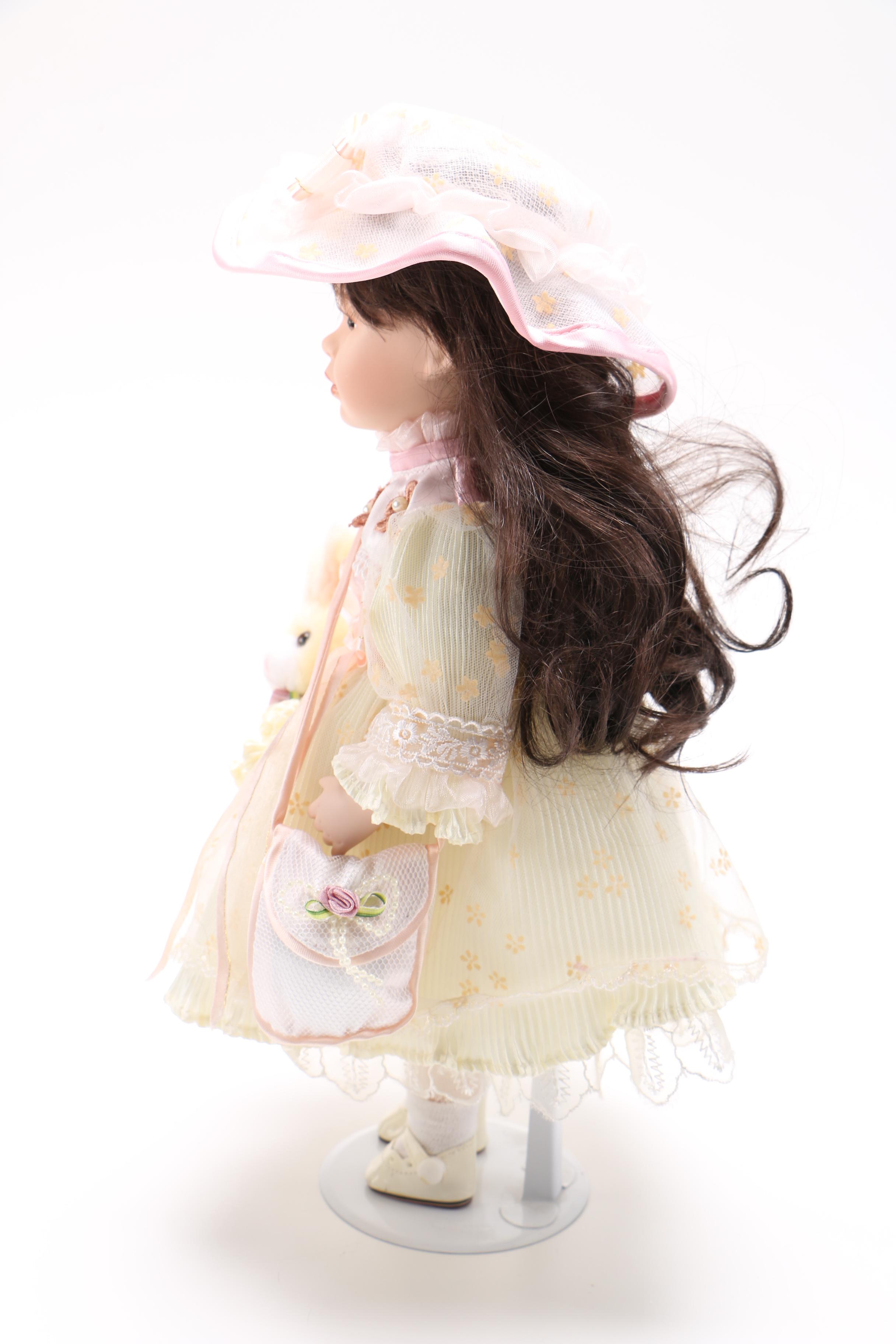 Porcelain Doll with Stuffed Rabbit
