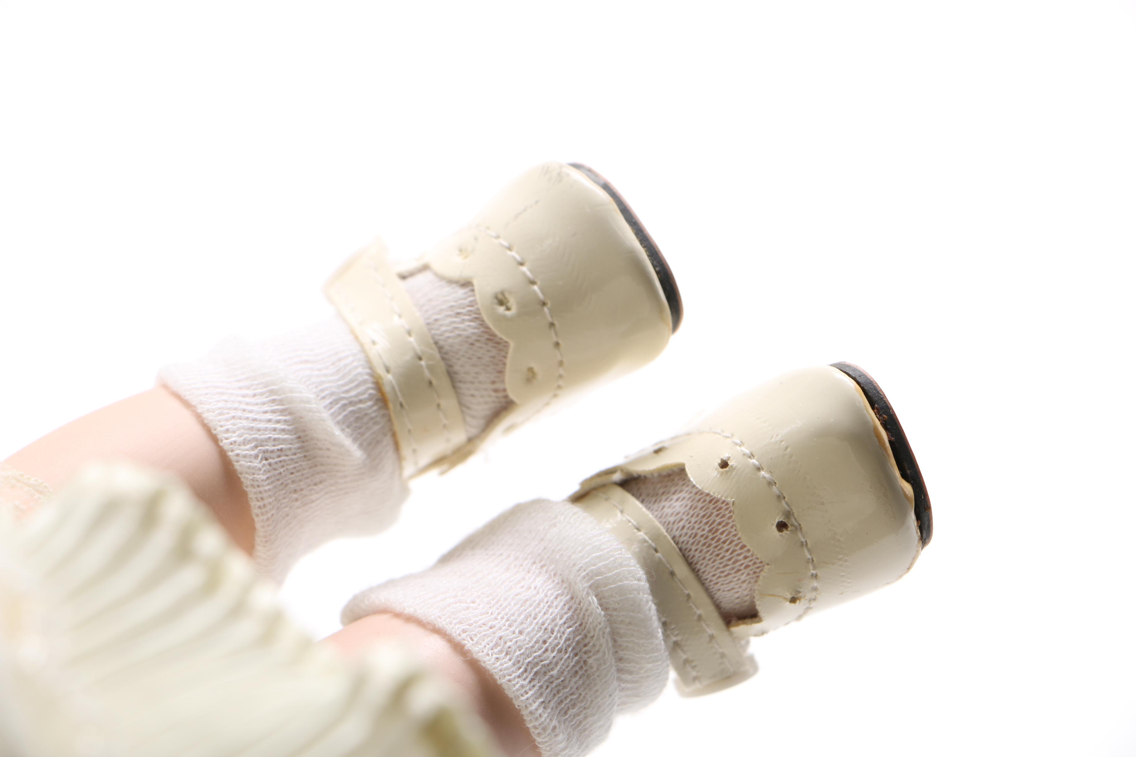 Porcelain Doll with Stuffed Rabbit