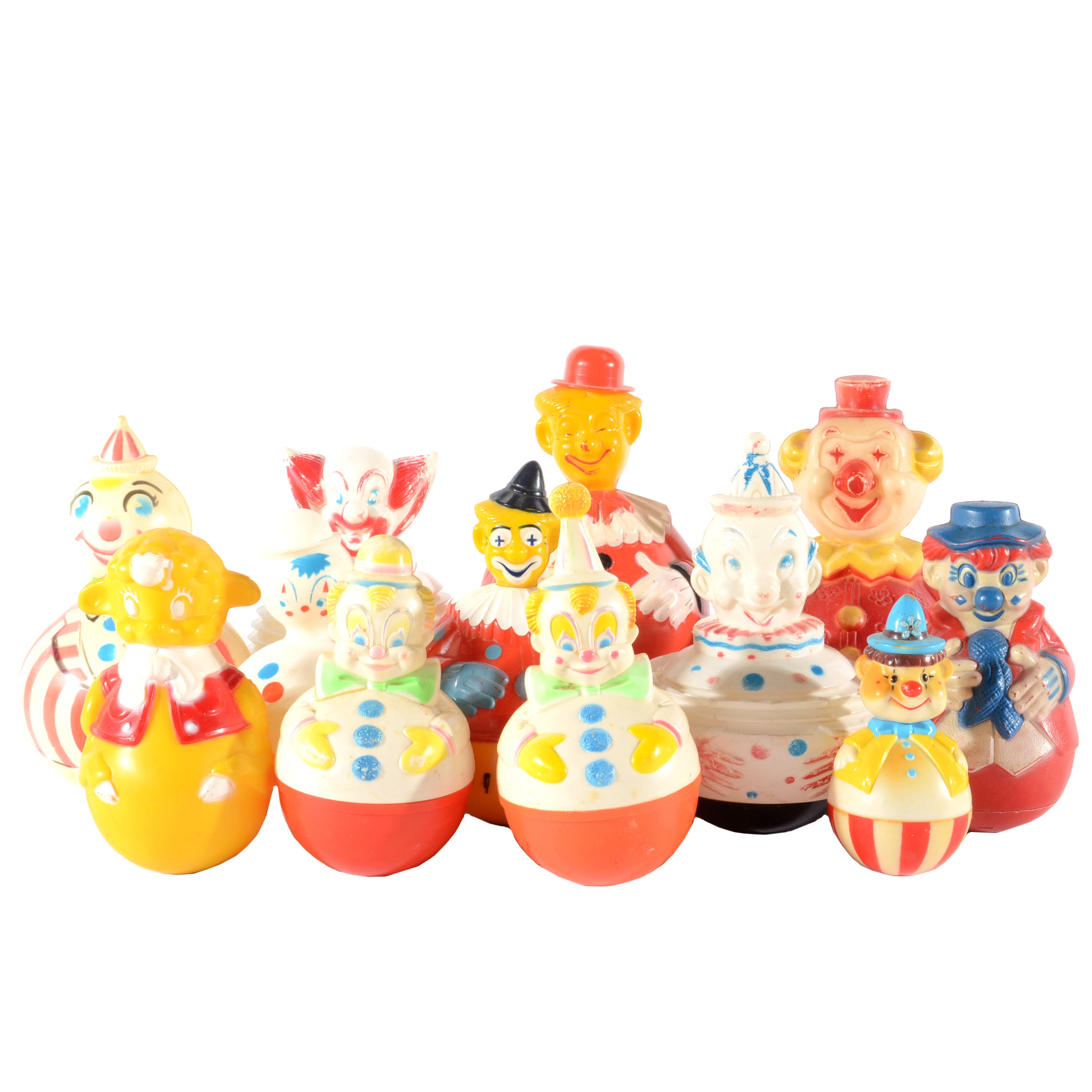 Twelve 1940s-1960s Rolly Polly Children Toys