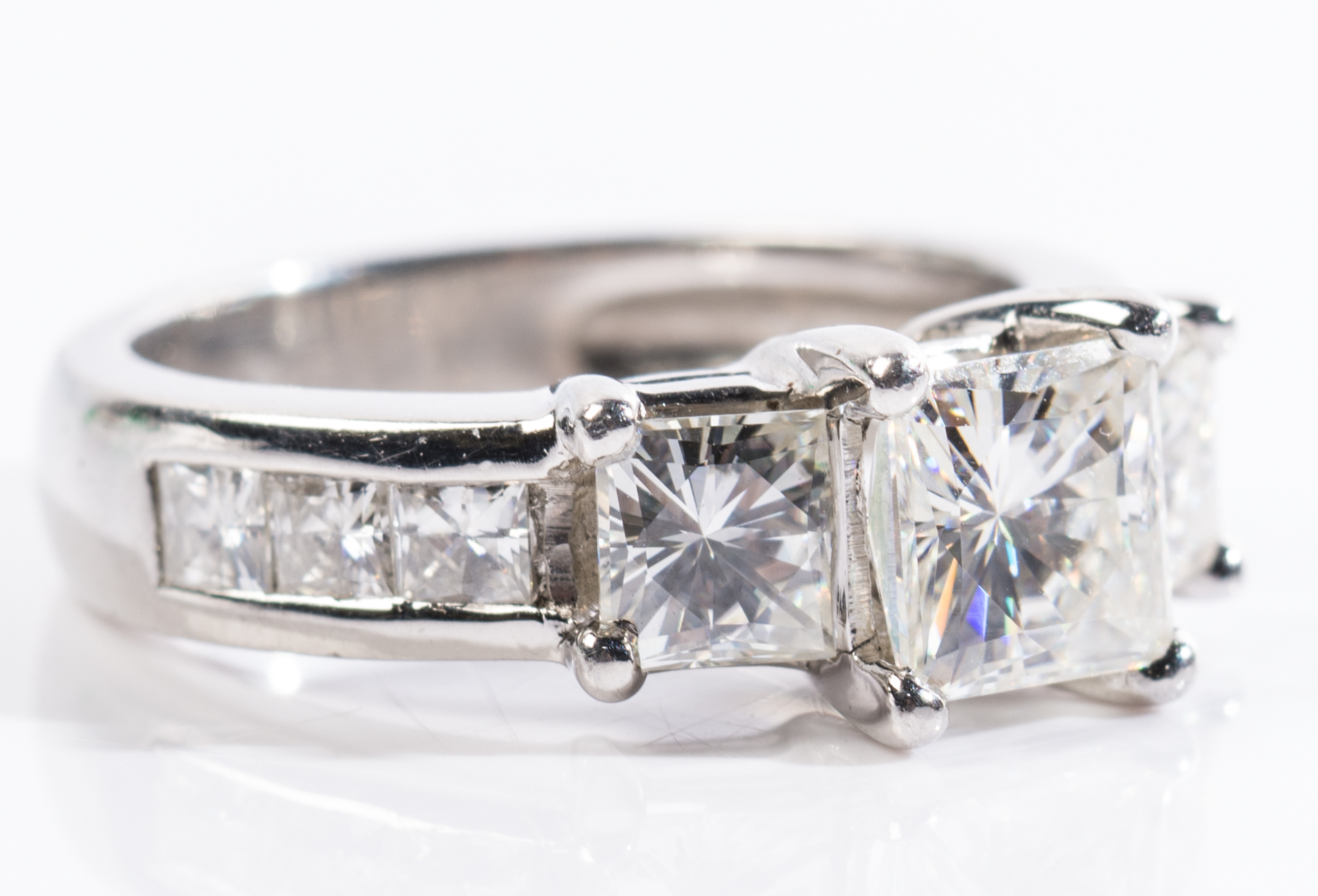 Platinum Three-Stone Moissanite Ring and Eternity Band