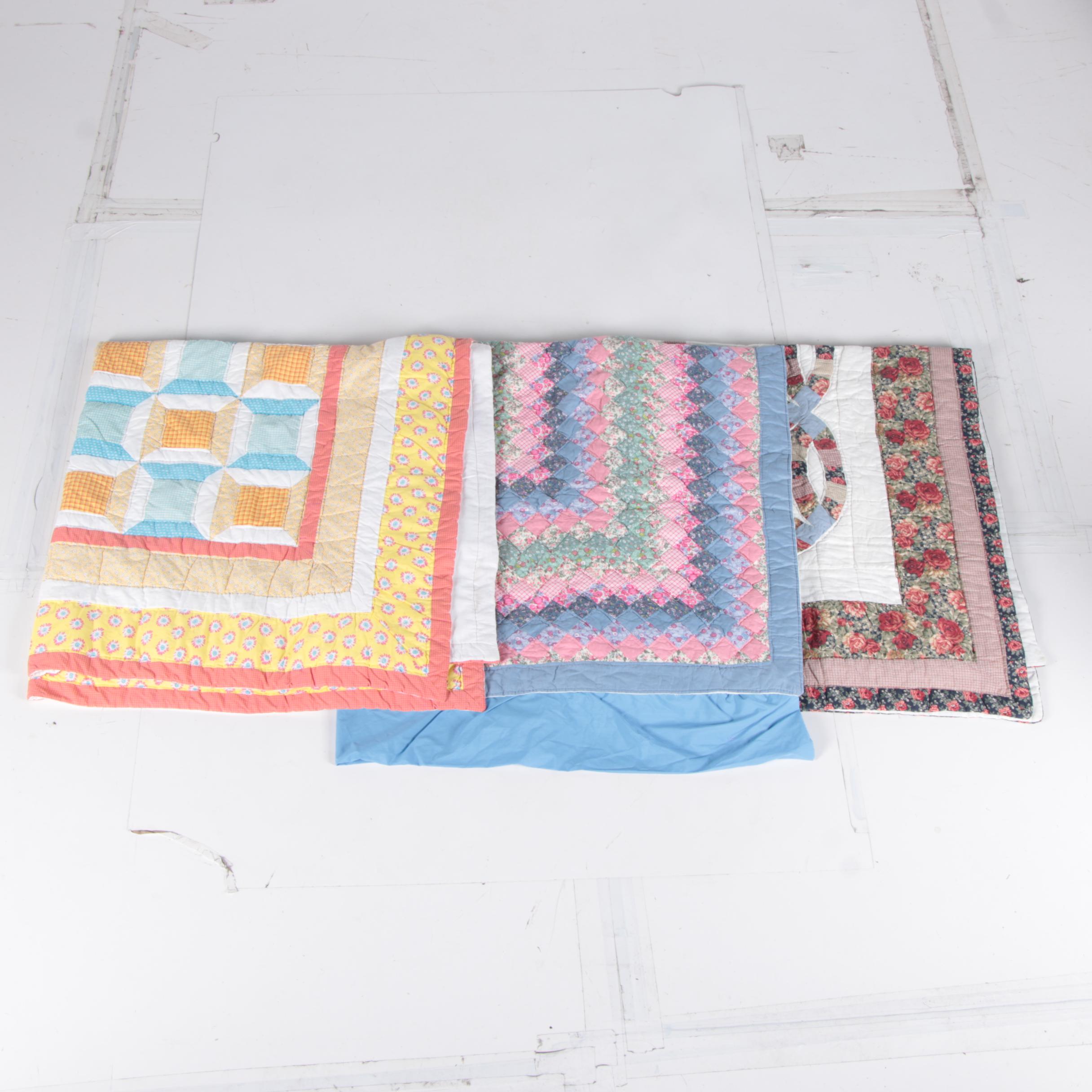 Hand Picked Quilts in "Spool", "Trip Around the World" and "Wedding Ring"