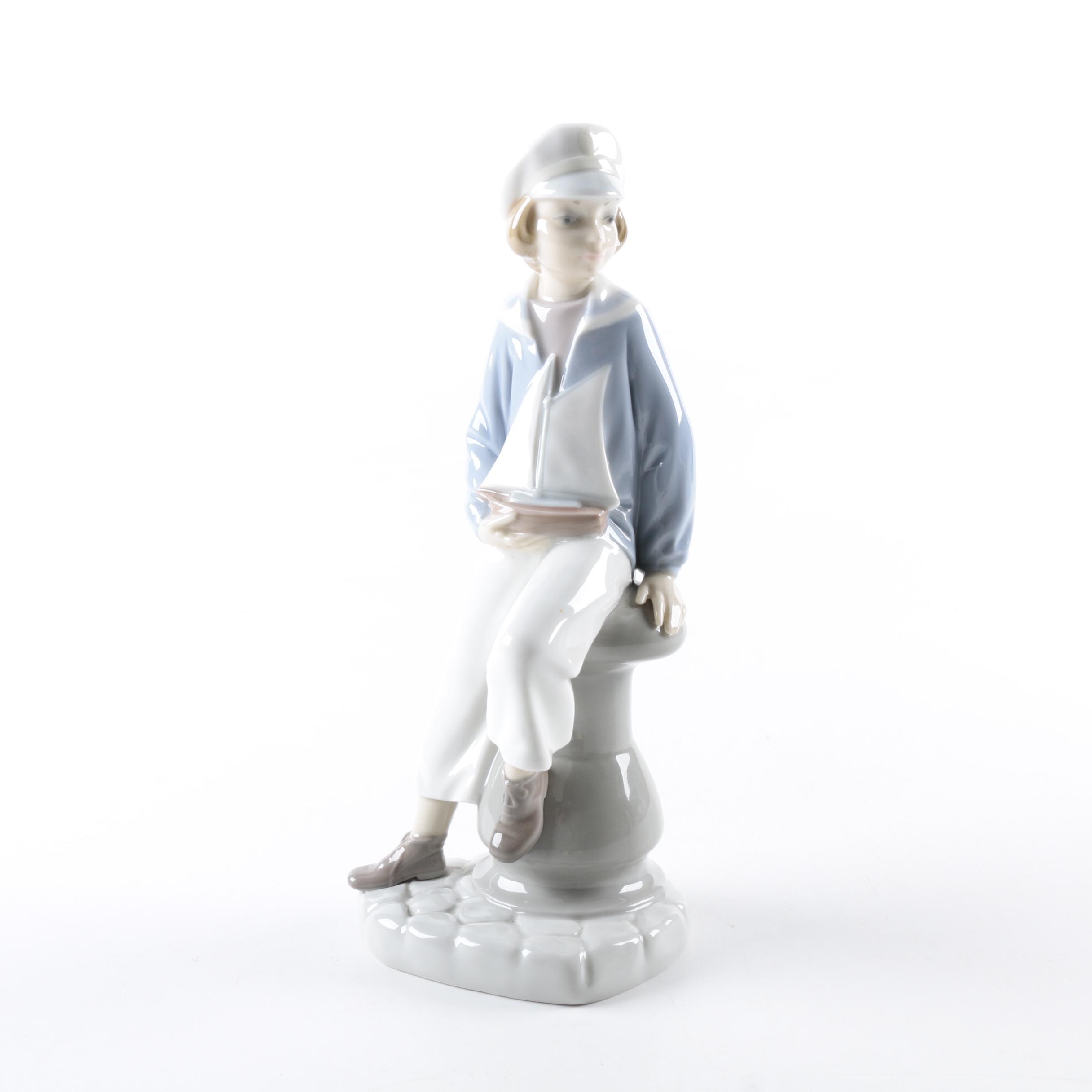 Retired Lladró "Boy with Yacht" Figurine