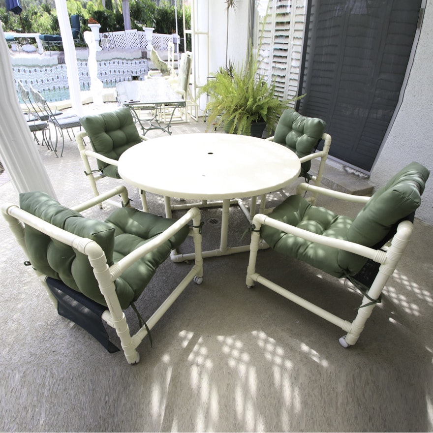 Patio Table with Tubular Frame and Four Matching Chairs