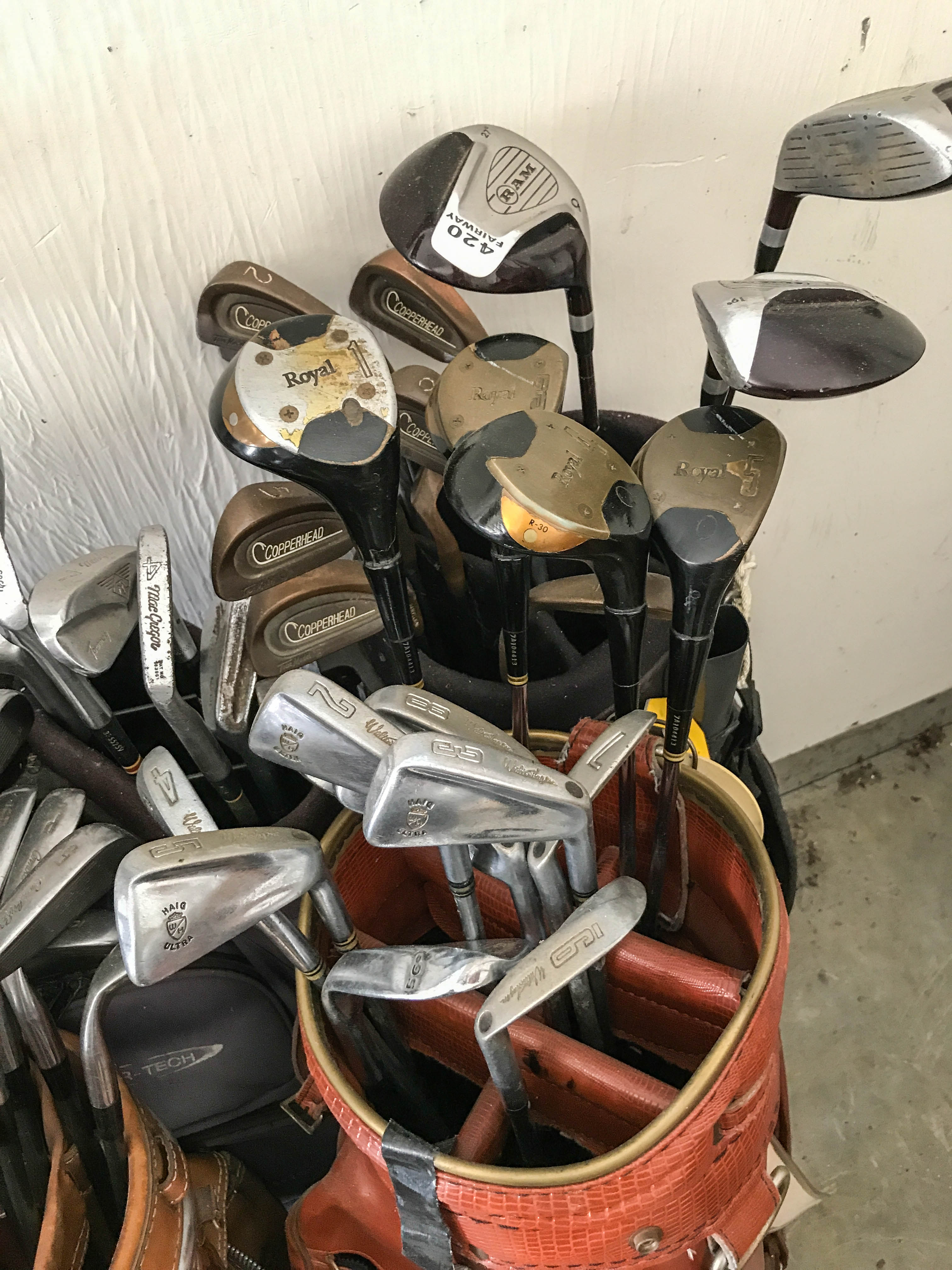 Five Golf Bags With Assorted Club Sets