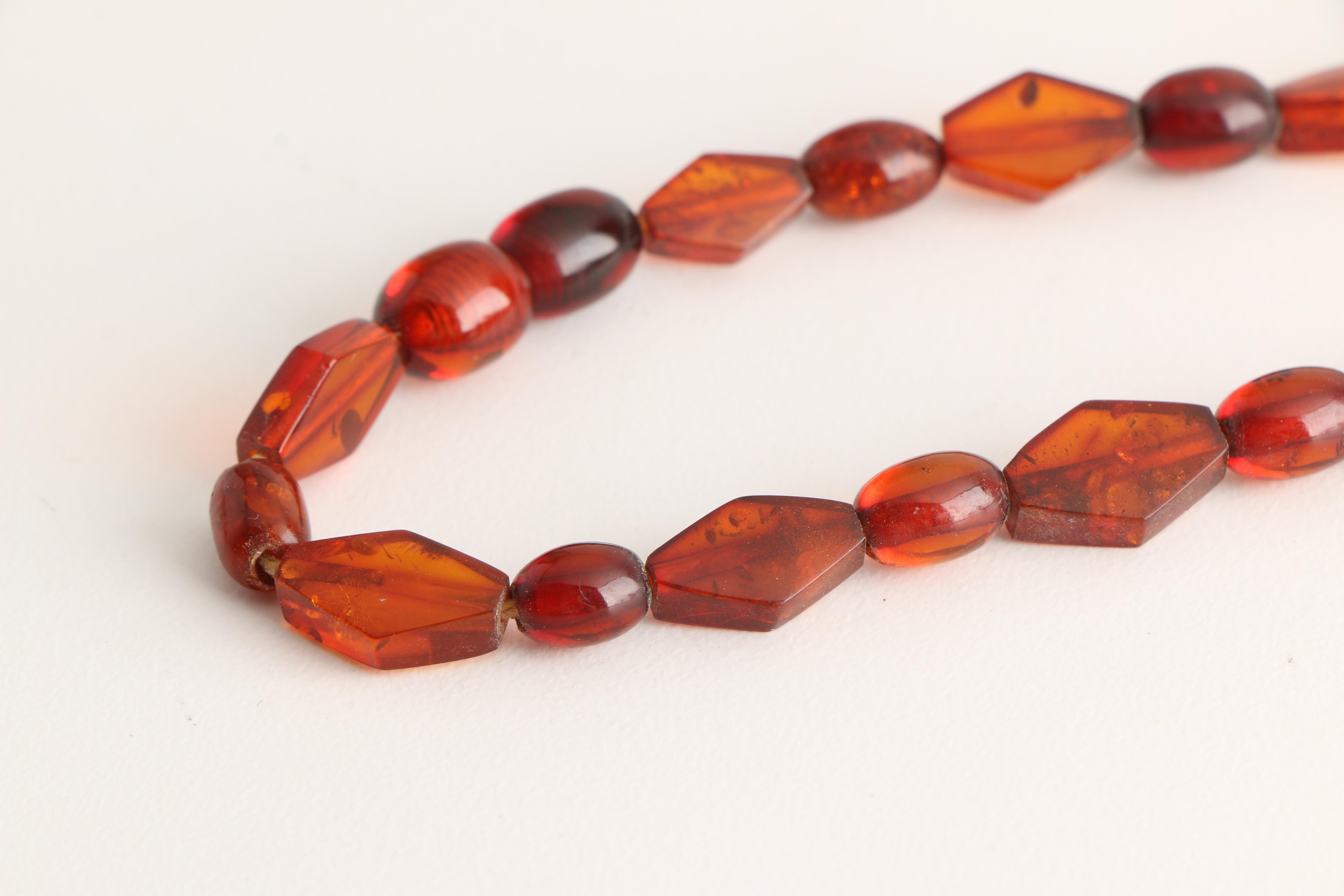 Three Amber Necklaces Including Mutton Fat Amber