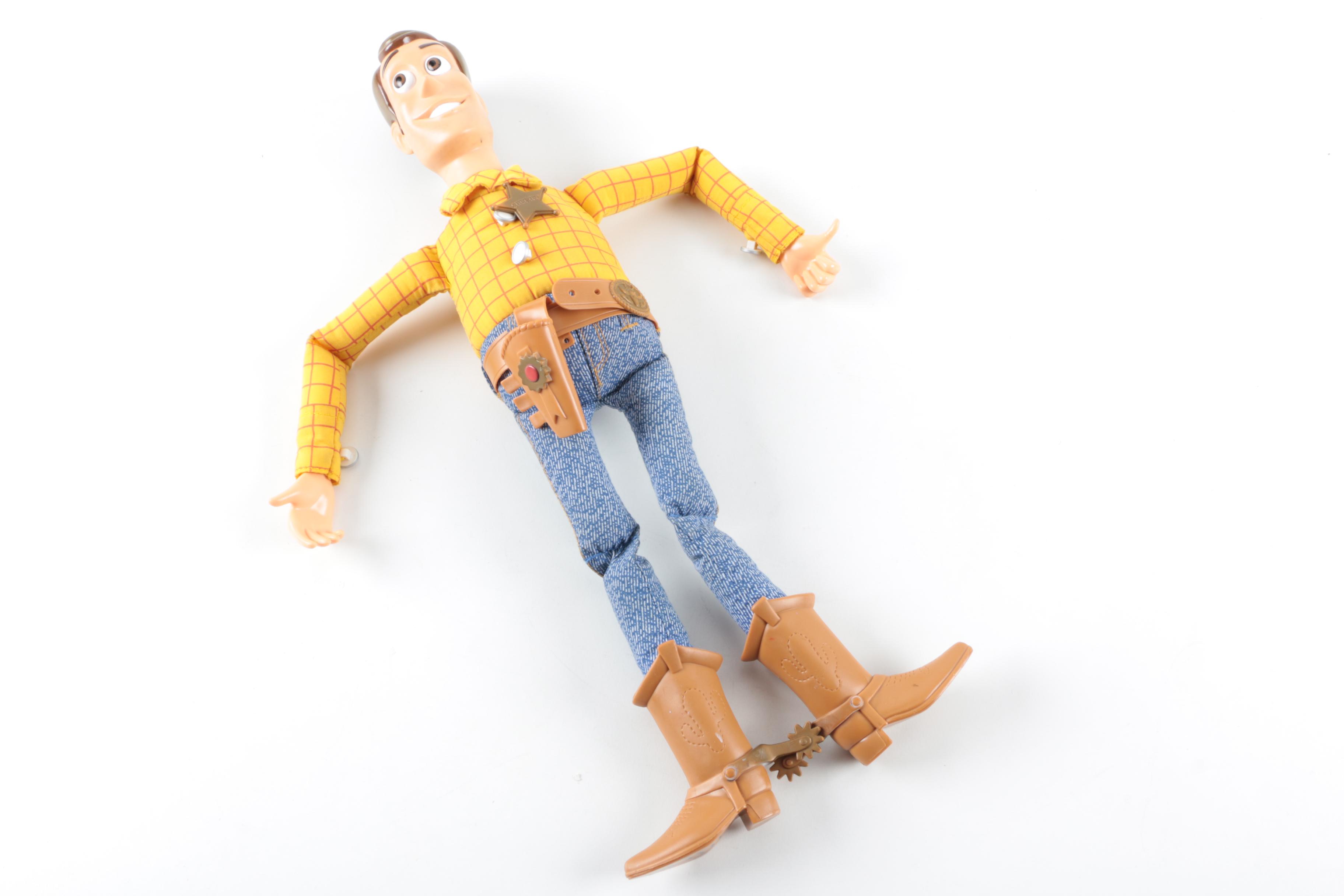 Collection of Sheriff Woody, Pee Wee Herman, and Ernest P. Worrell Dolls