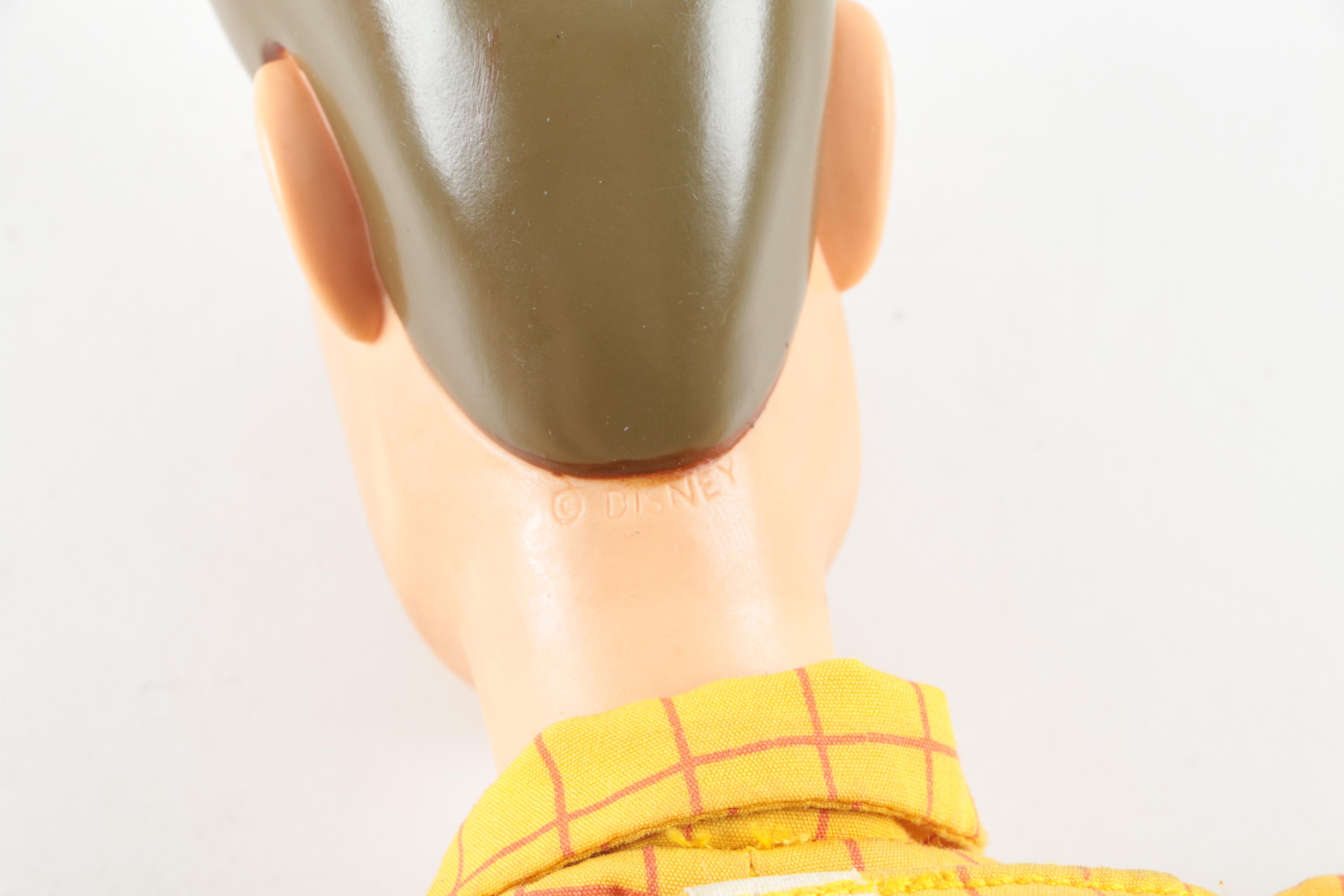 Collection of Sheriff Woody, Pee Wee Herman, and Ernest P. Worrell Dolls