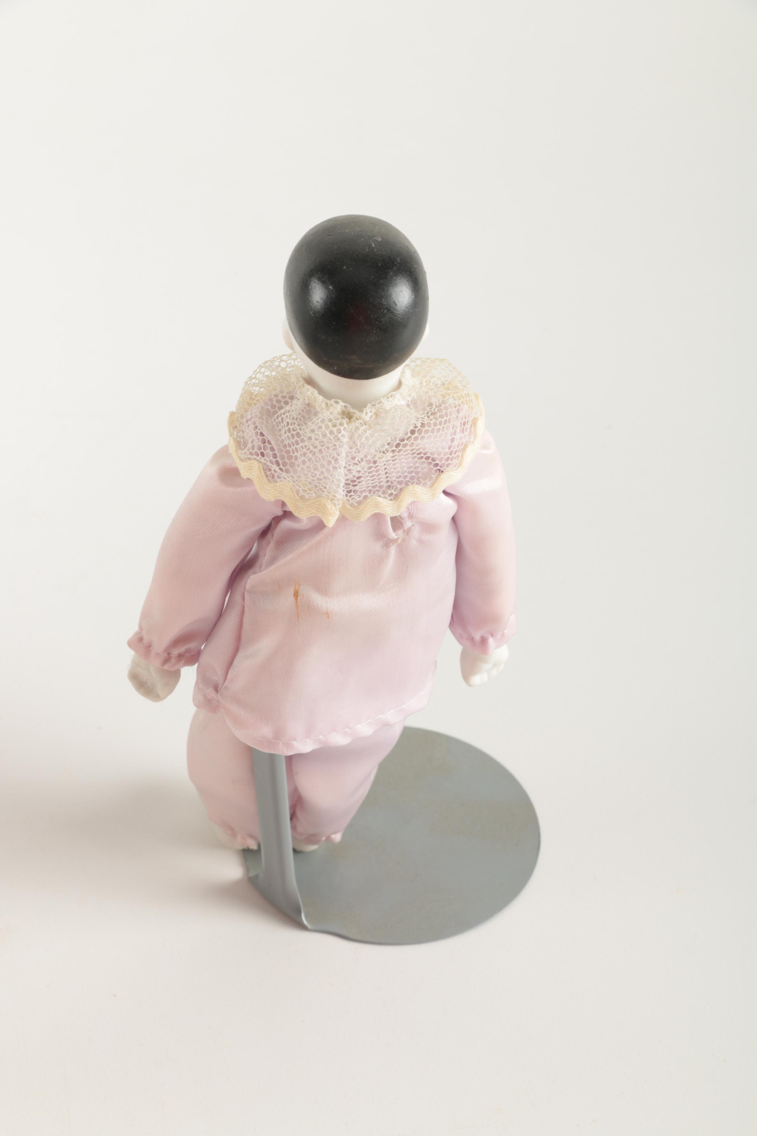 Three Porcelain Clown Dolls