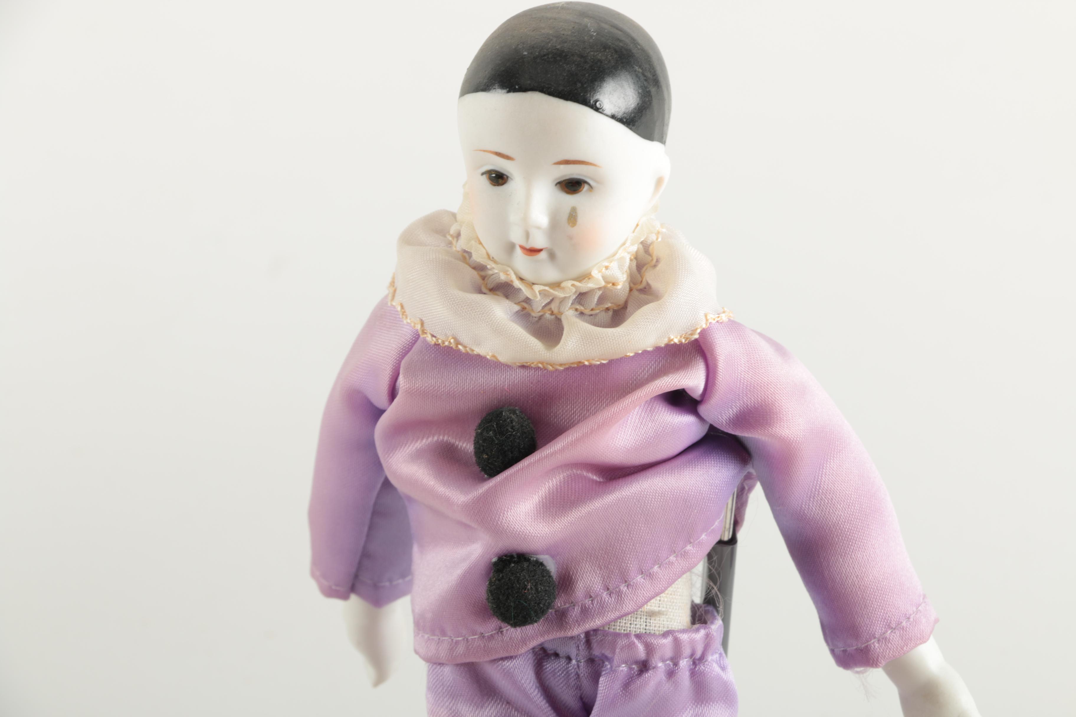 Three Porcelain Clown Dolls