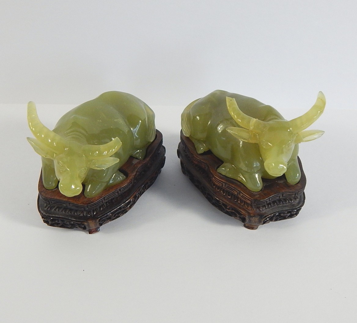 Two Vintage Jadeite Bull Figurines on Lotus Base